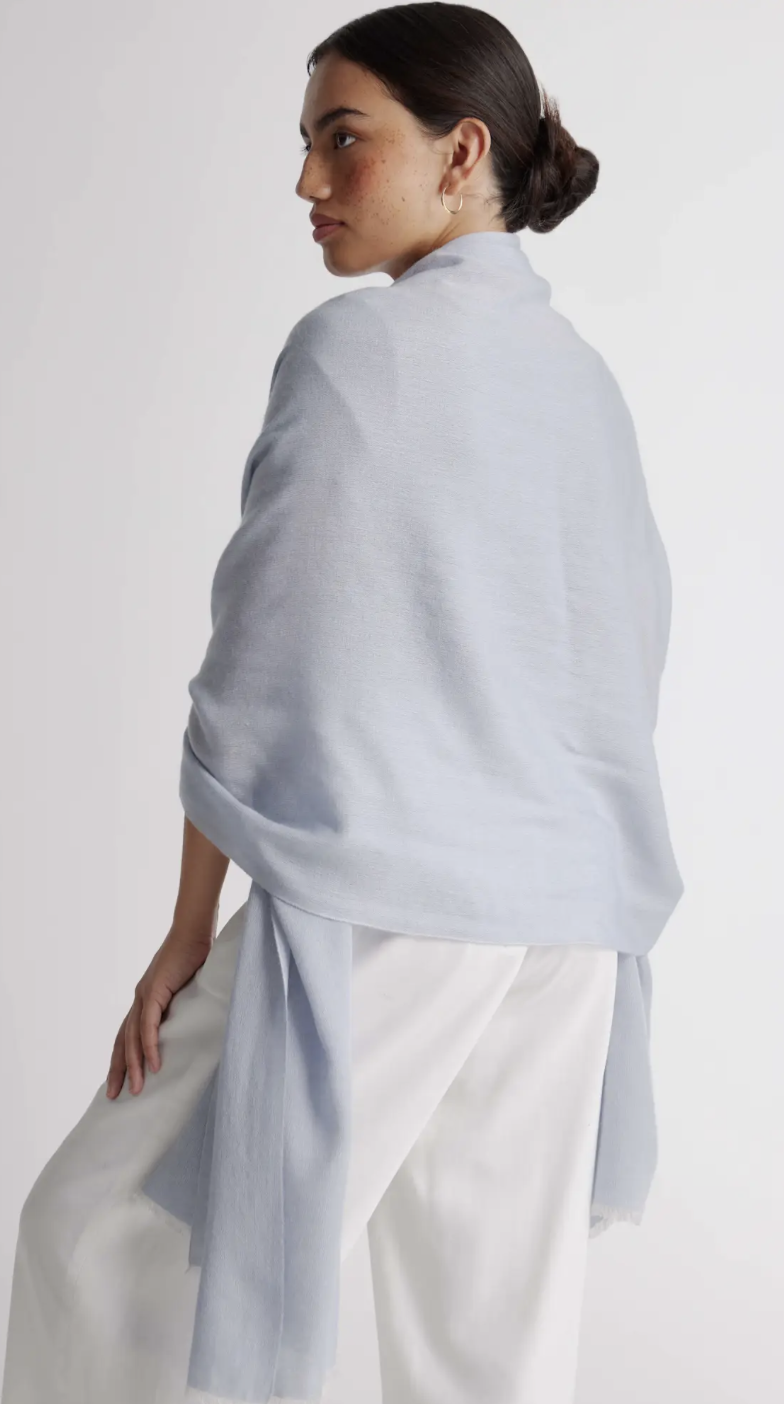 Quince featherweight cashmere silk frayed edge scarf in light blue.