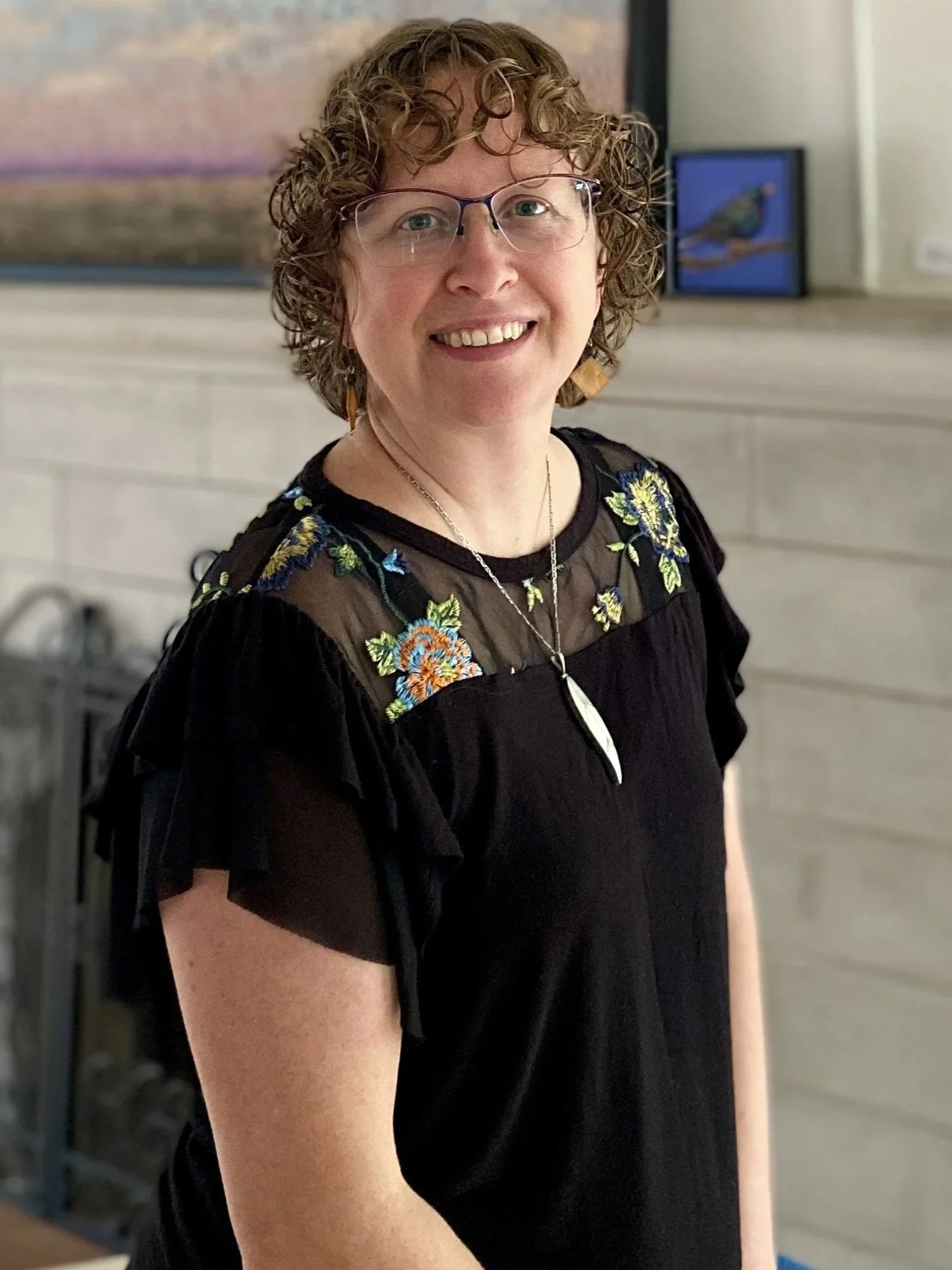 Woman smiling in black shirt