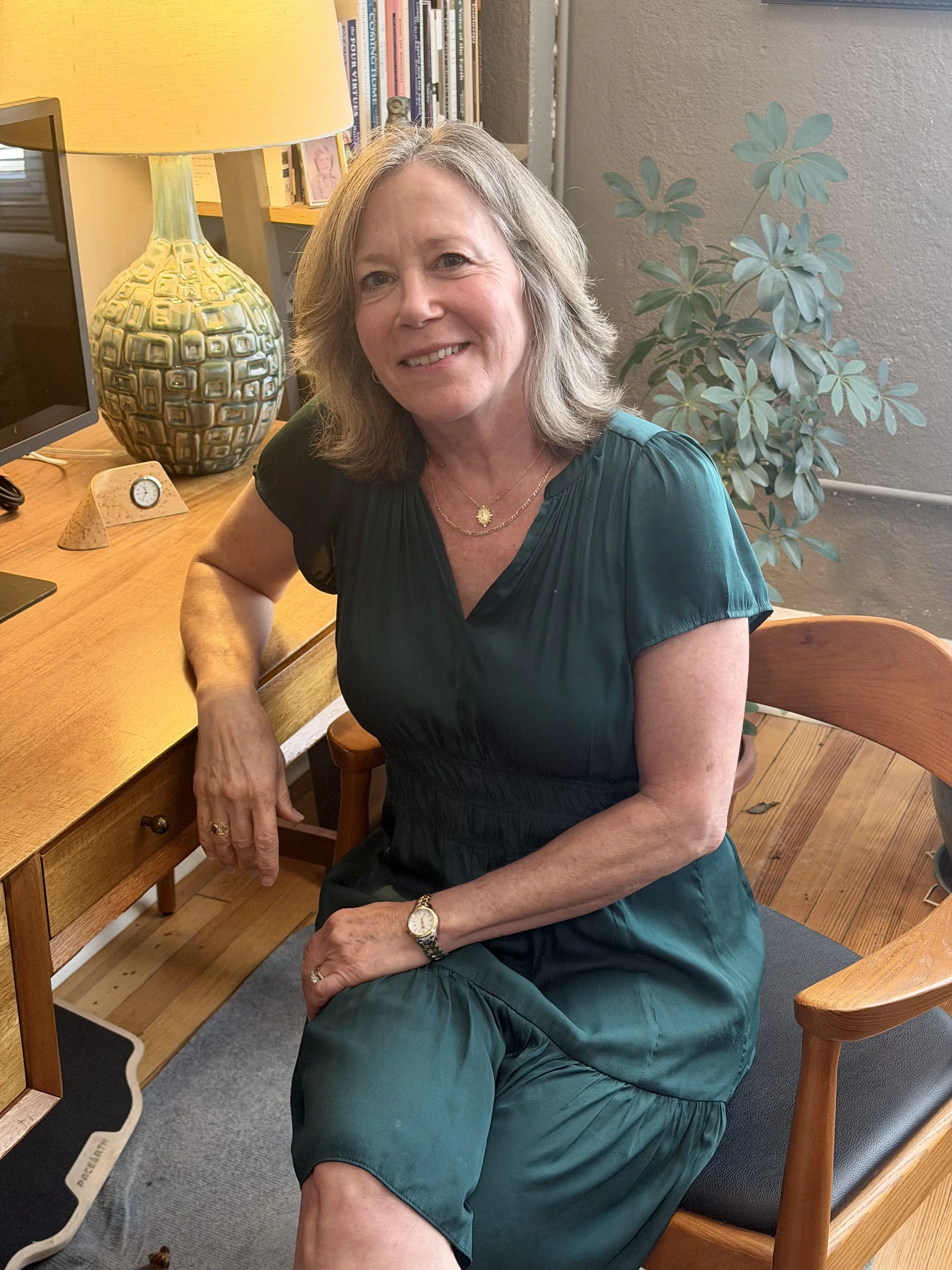 Psychotherapist Colette Segalla, PhD, LCMHC, seated in her Raleigh office.