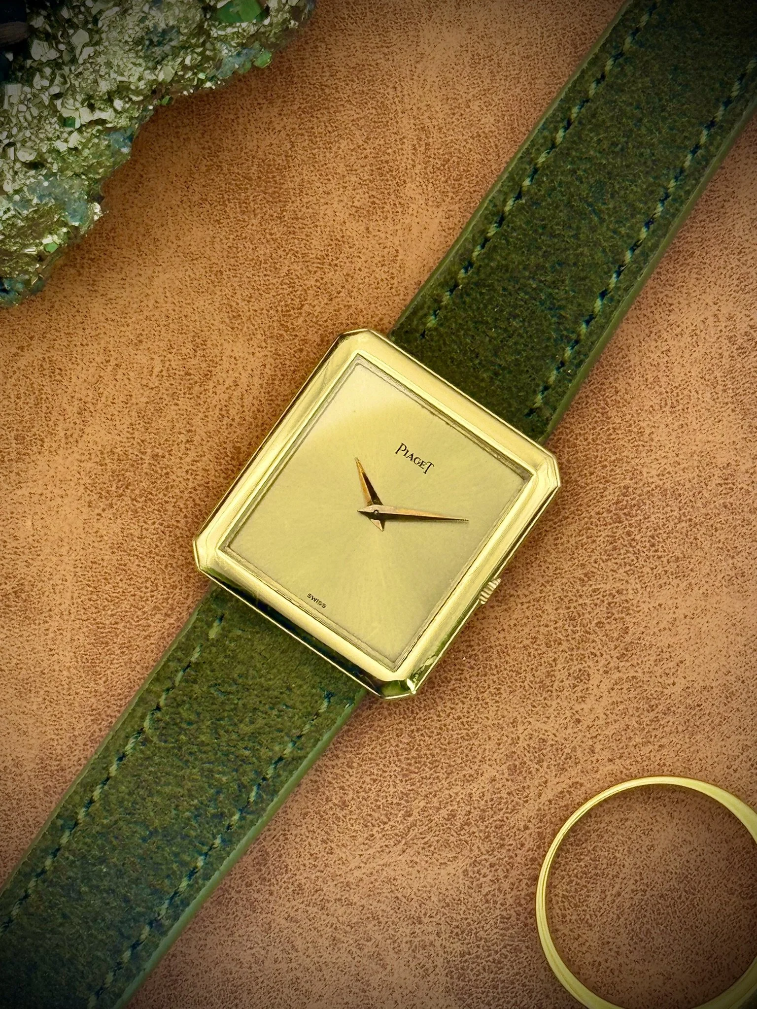A vintage Piaget Protocole Reference 91542 in yellow gold with a gold sunburst dial.