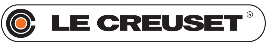 Le Creuset logo in black text with an orange dot inside a black circle to the left.