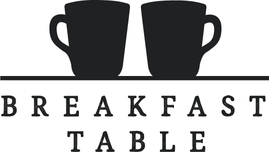 Two coffee mugs with the word "BREAKFAST" spelled below, and the text "TABLE" underneath.