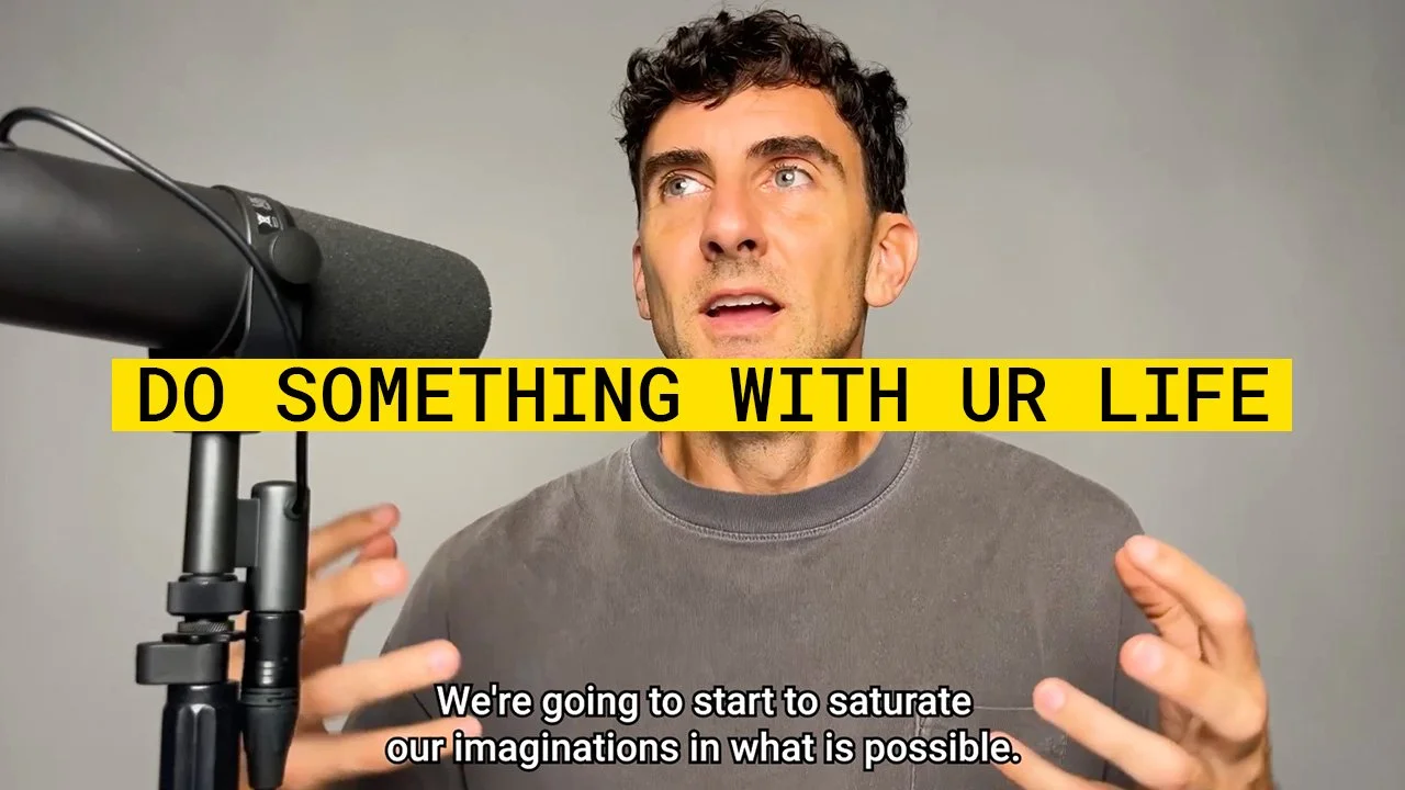 A man speaking into a microphone during a recording session, gesturing with his hands, with a motivational quote overlayed that says: "DO SOMETHING WITH UR LIFE." subtitles read: "We're going to start to saturate our imaginations in what is possible."