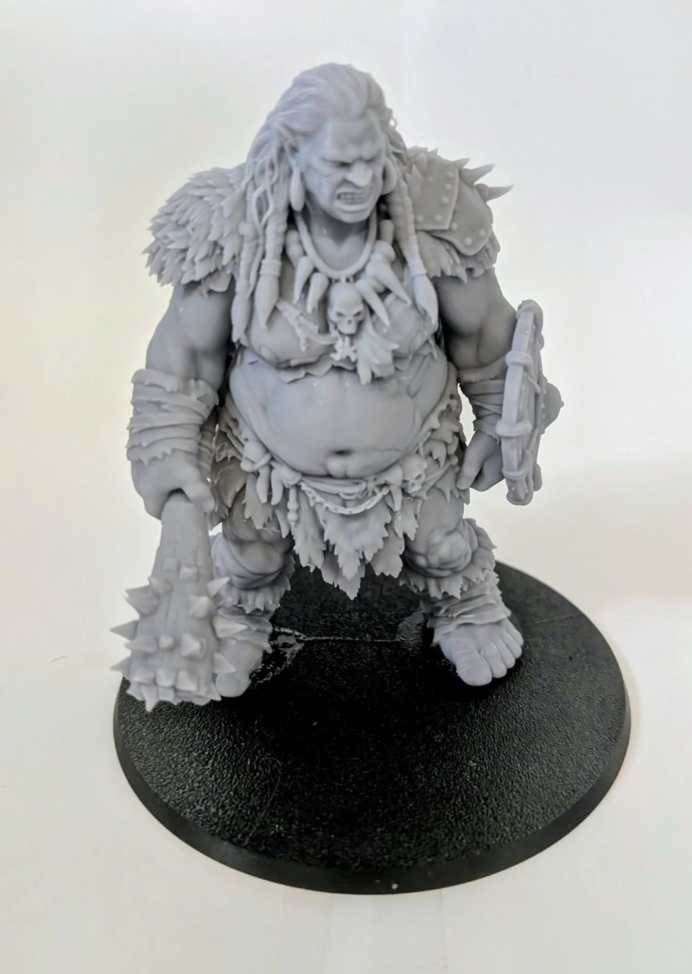 Hill Giant – Shield Matron resin miniature, unpainted, front view showing braided hair and spiked club