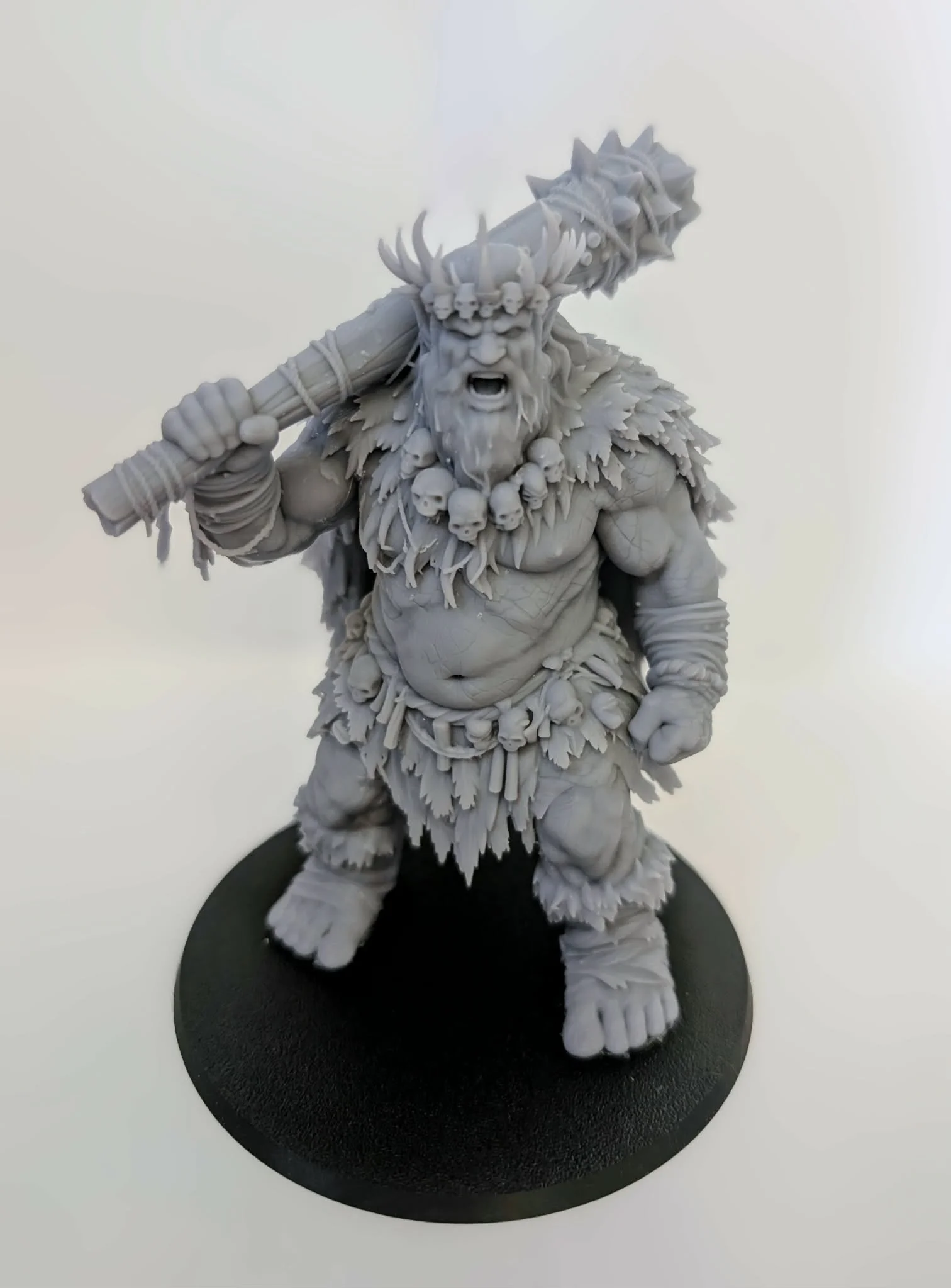 Hill Giant – Tribal King resin miniature, unpainted, front view with crown and spiked club raised over its shoulder