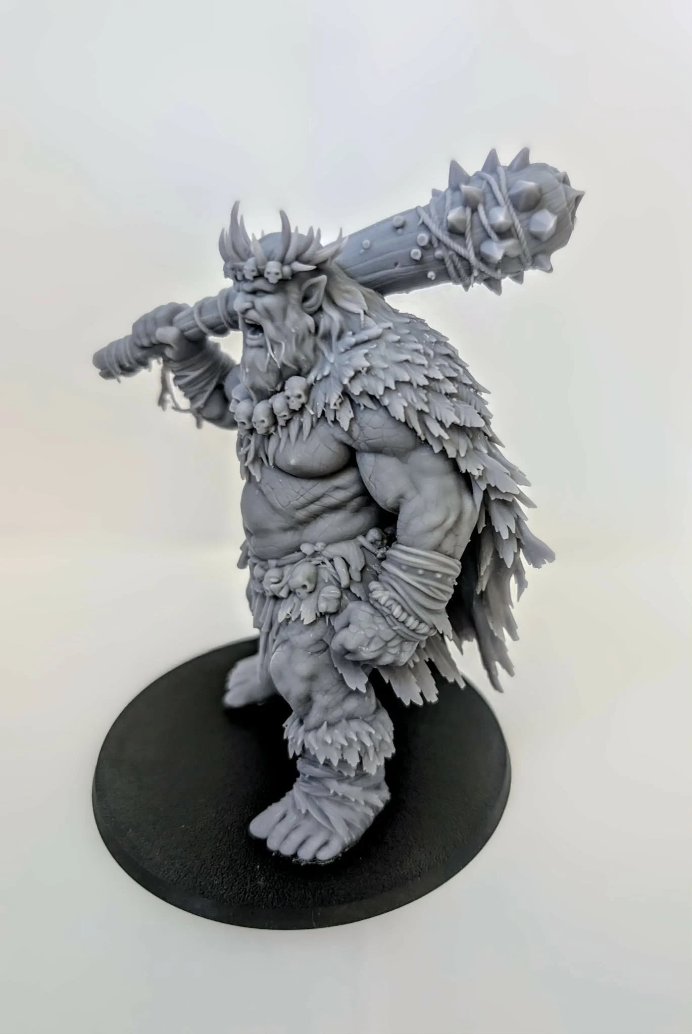 Hill Giant – Tribal King resin miniature, unpainted, side view with spiked club over its shoulder