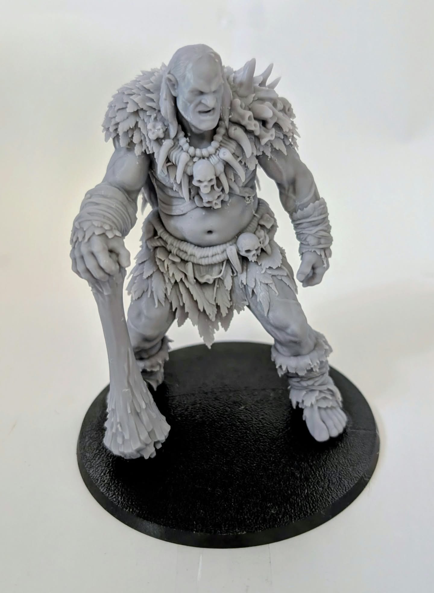 Hill Giant – Bone Breaker resin miniature, unpainted, front view in fur and bone armour with a club at its side