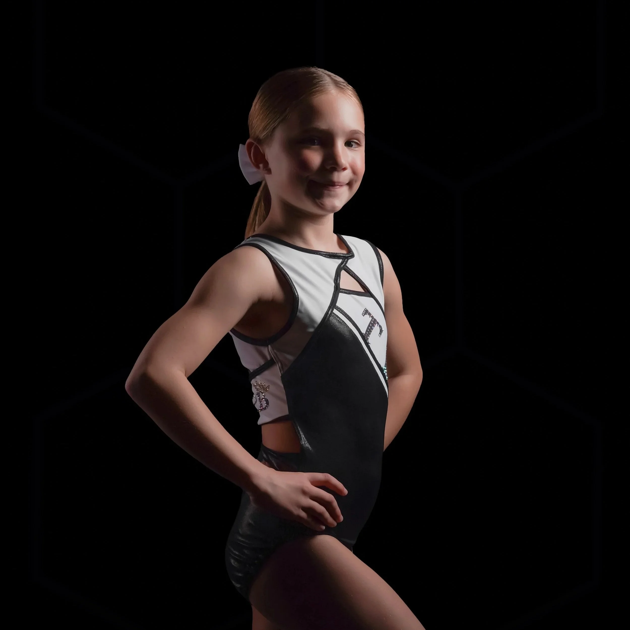 Young gymnast posing for a professional gymnastics portrait in South Florida