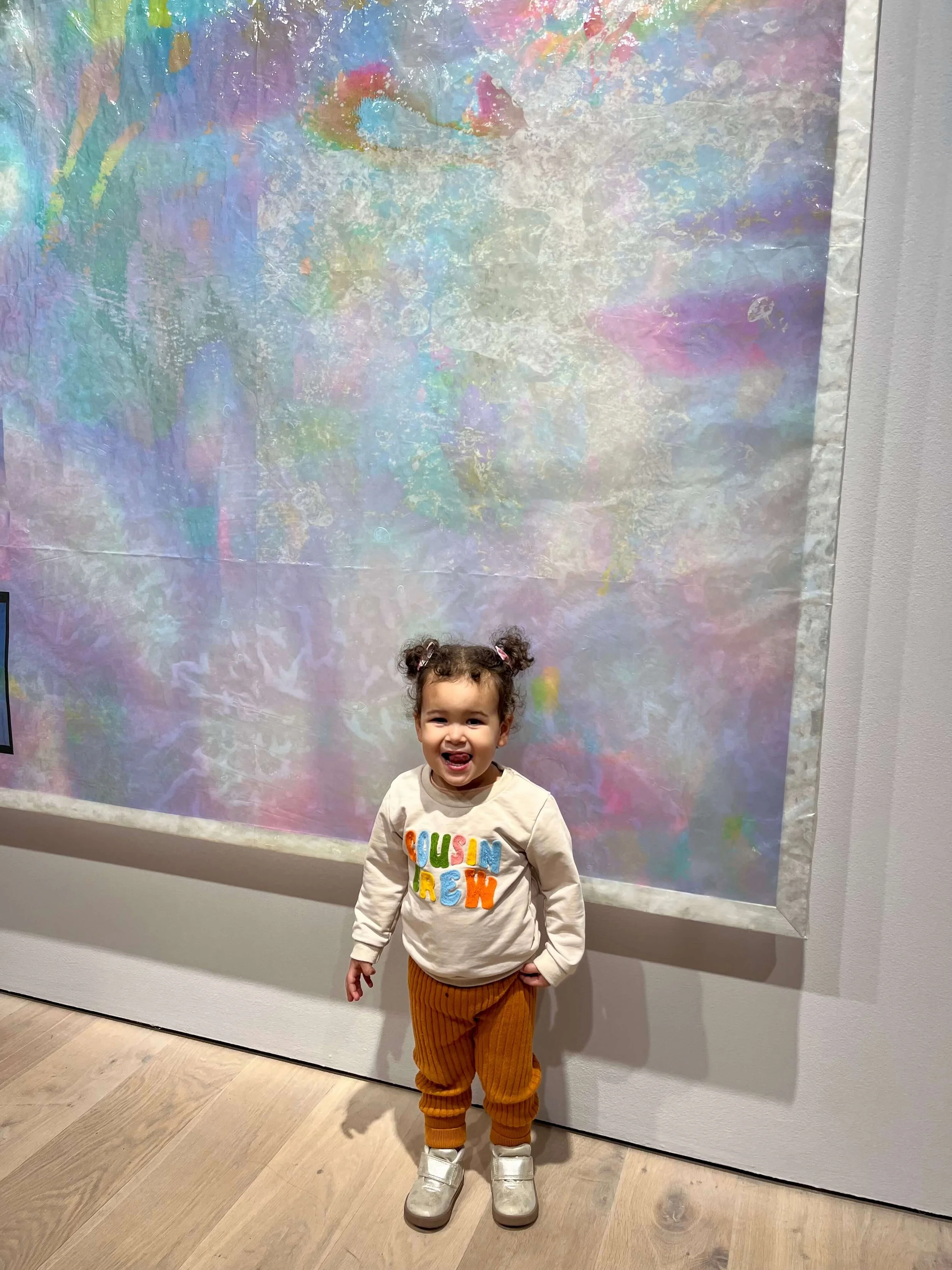 little girl standing in front of an art exhibit at the Polygon Gallery Kids First Event