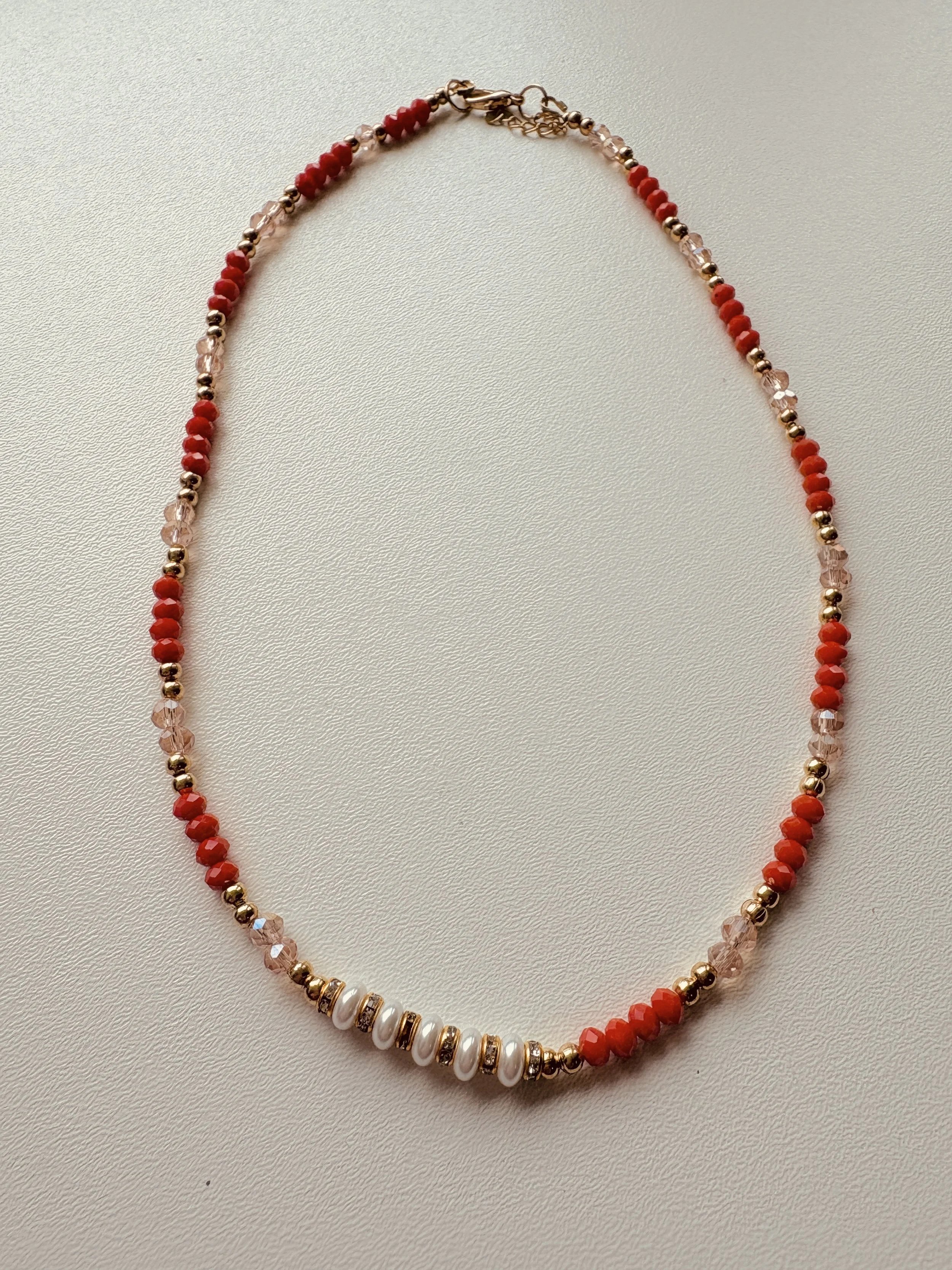 red and pearl accent necklace