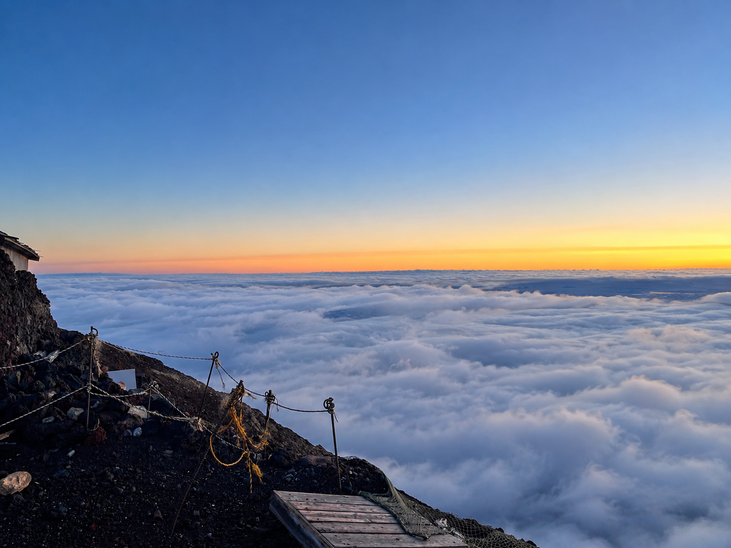 Mountain sunrise above a sea of clouds