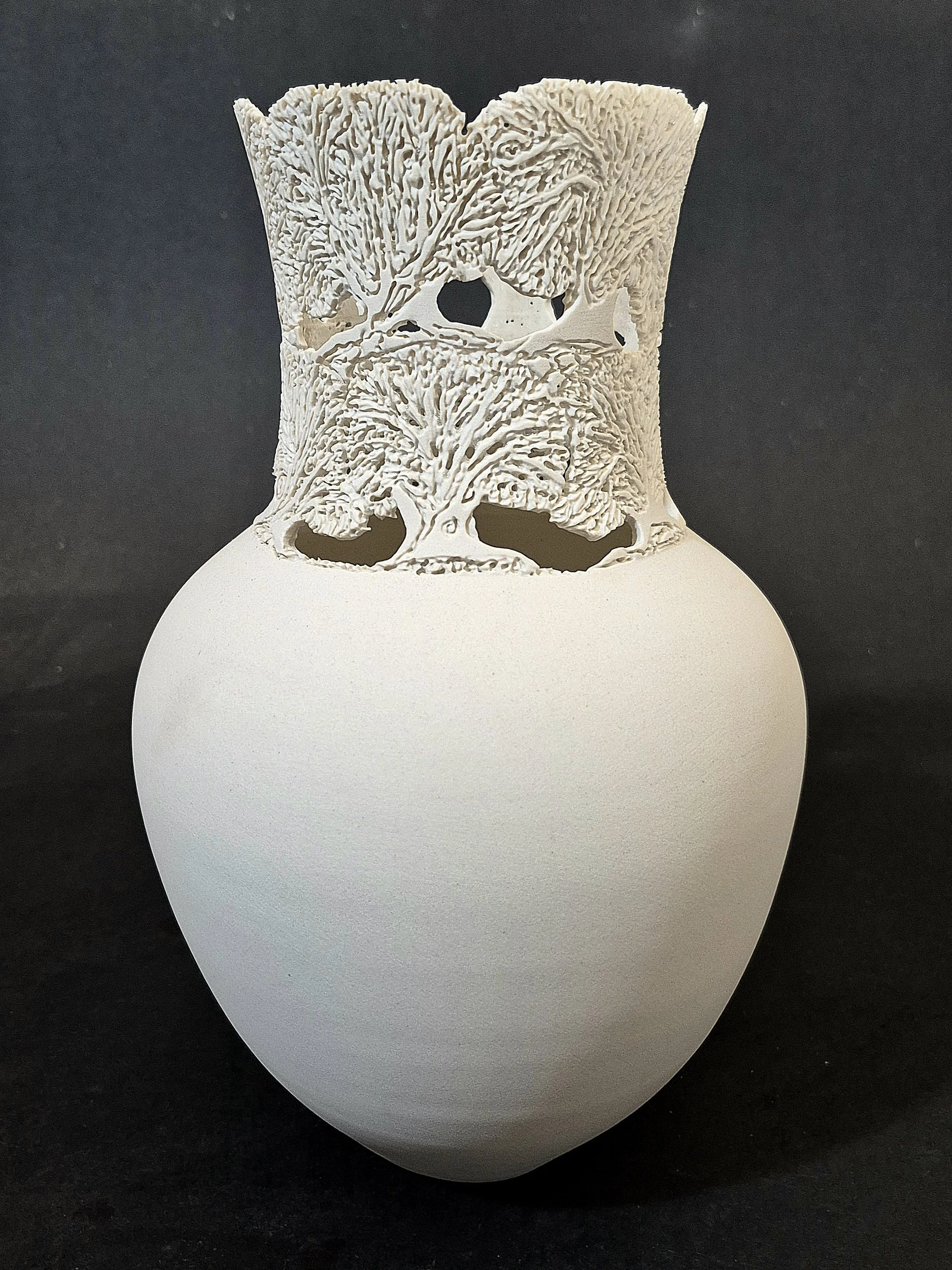 Carved Porcelain Vase with 2 tiers of oak trees. 11" Tall  Unglazed