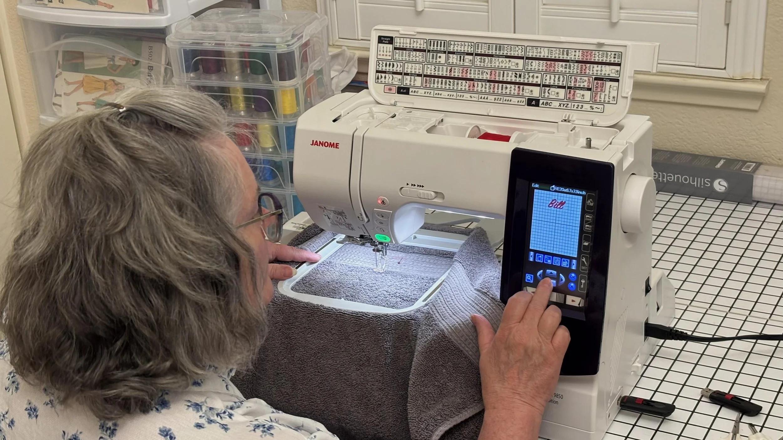 Nana Banana embroidering a towel