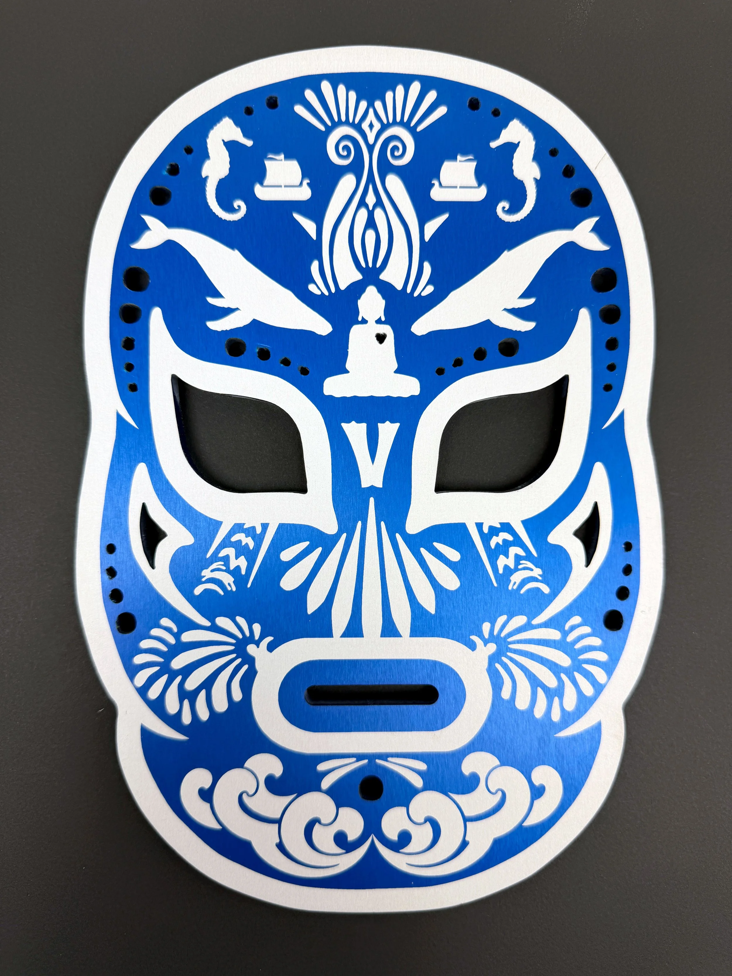 CO2 laser engraved anodized aluminum panel with a blue and white decorative pattern, custom metal engraving by MC Laser Labs.