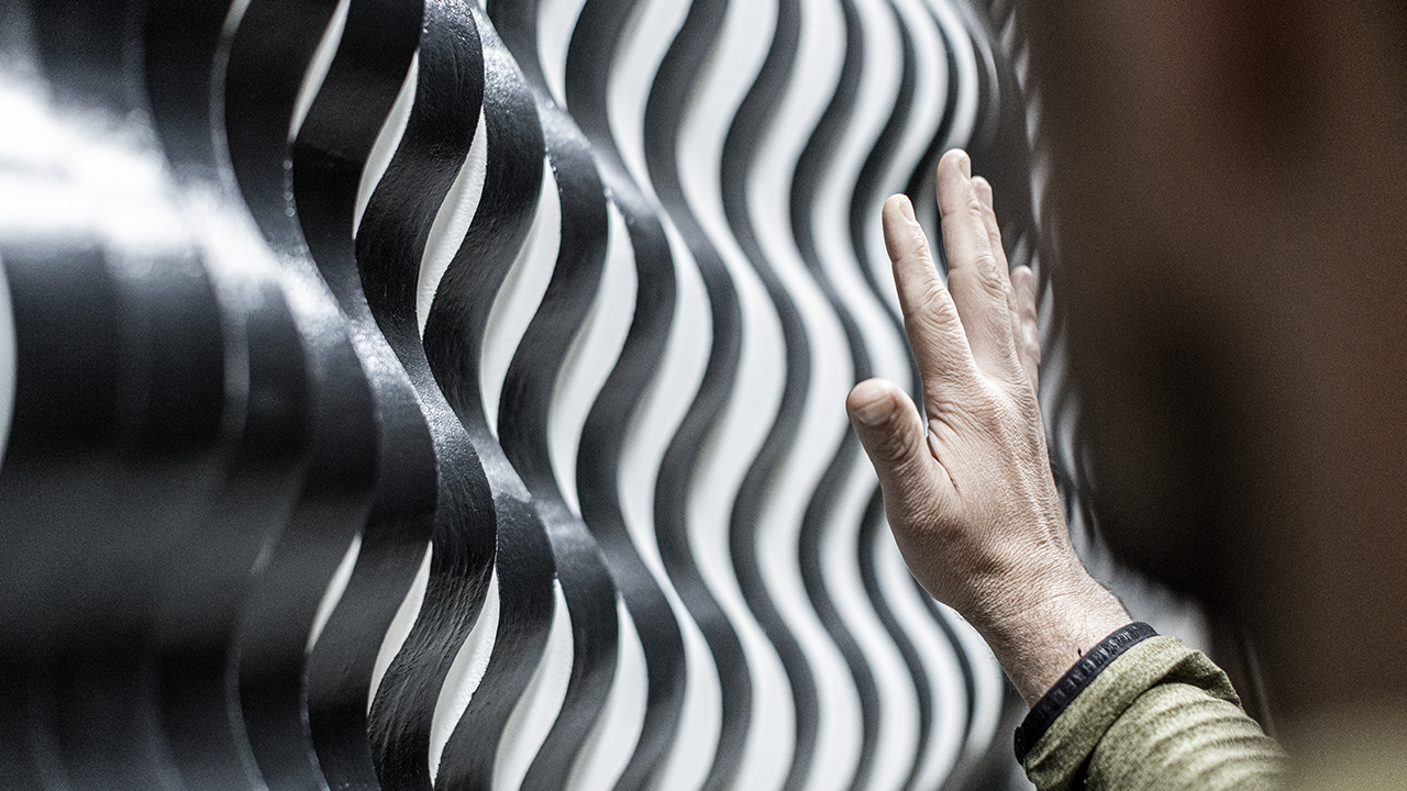The Wave Wall kinetic sculpture designed and fabricated by MC Laser Labs