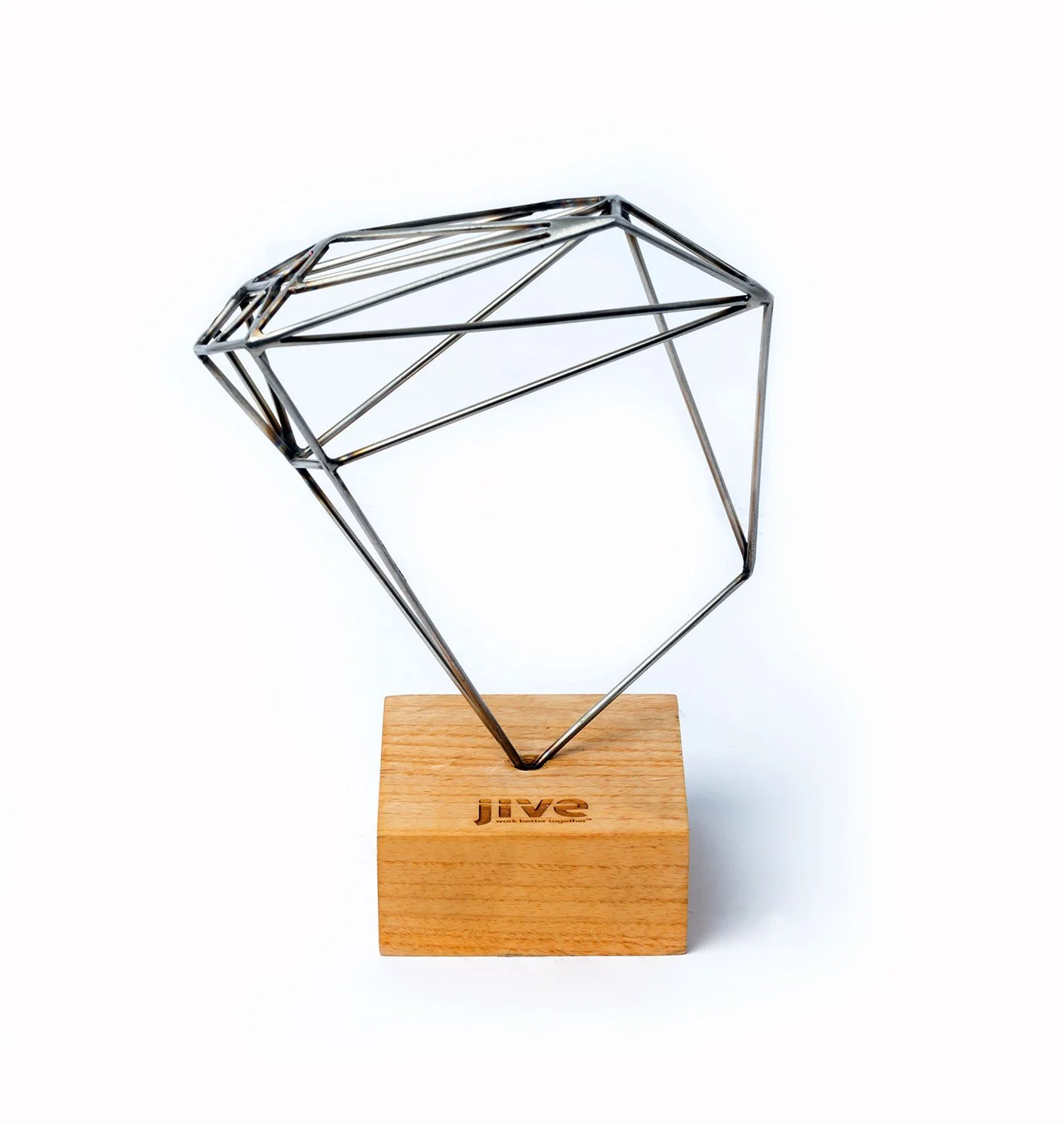 Custom welded and fabricated stainless steel diamond-shaped trophy sculpture on a wooden base reading 'Jive', custom laser cutting and engraving by MC Laser Labs.