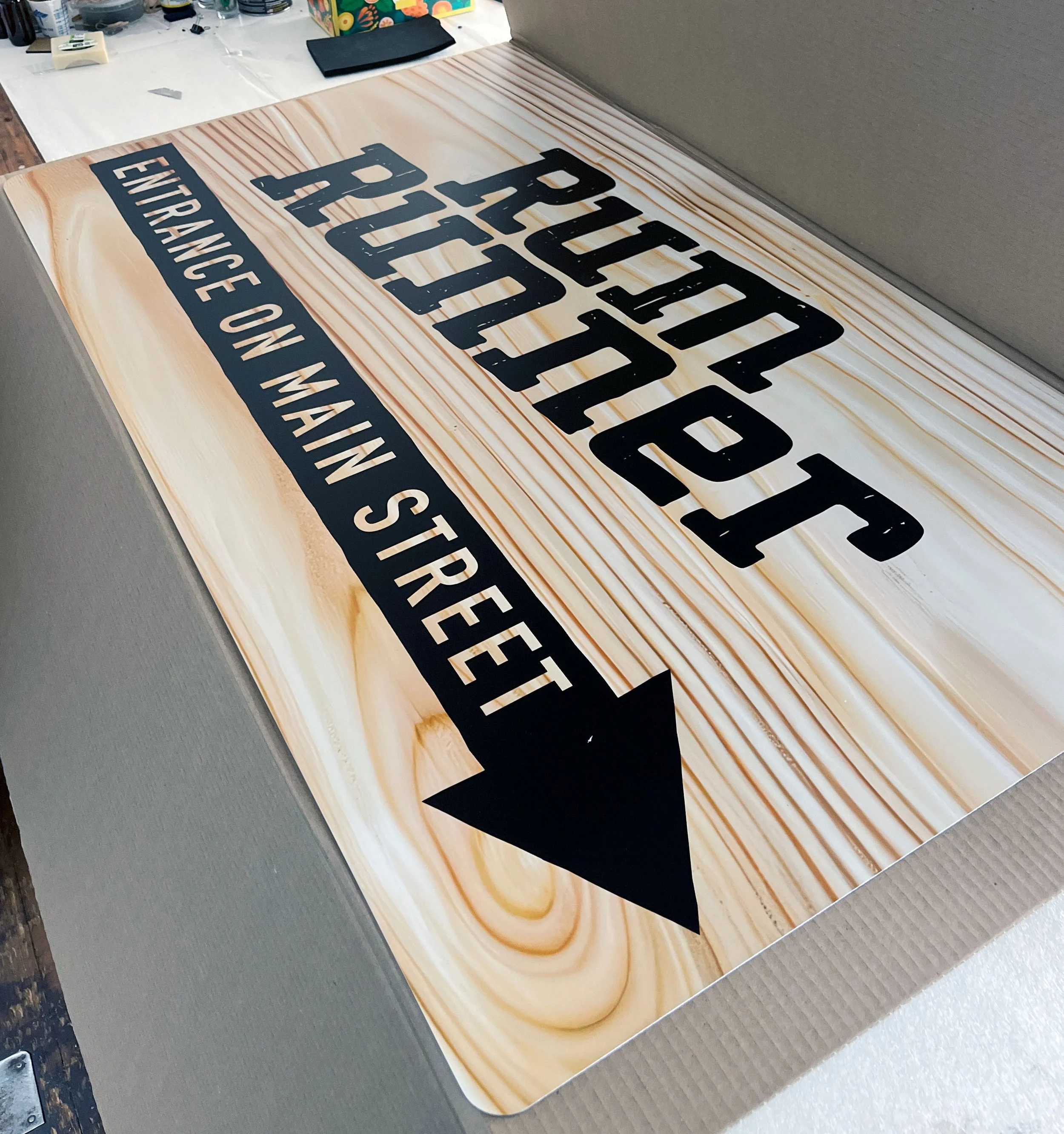 CO2 laser cut and engraved wooden sign for Truffe entrance, custom laser cutting and engraving by MC Laser Labs.