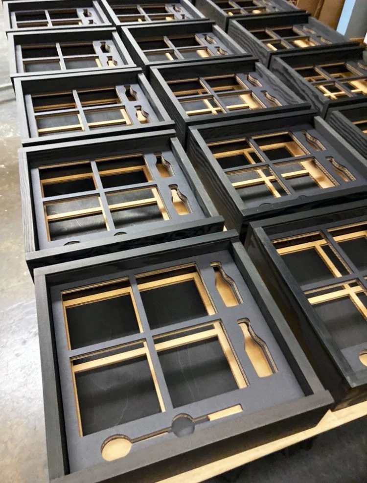 Black and gold wood box inserts for Centrex Construction seeding kit box, custom fabrication by MC Laser Labs.