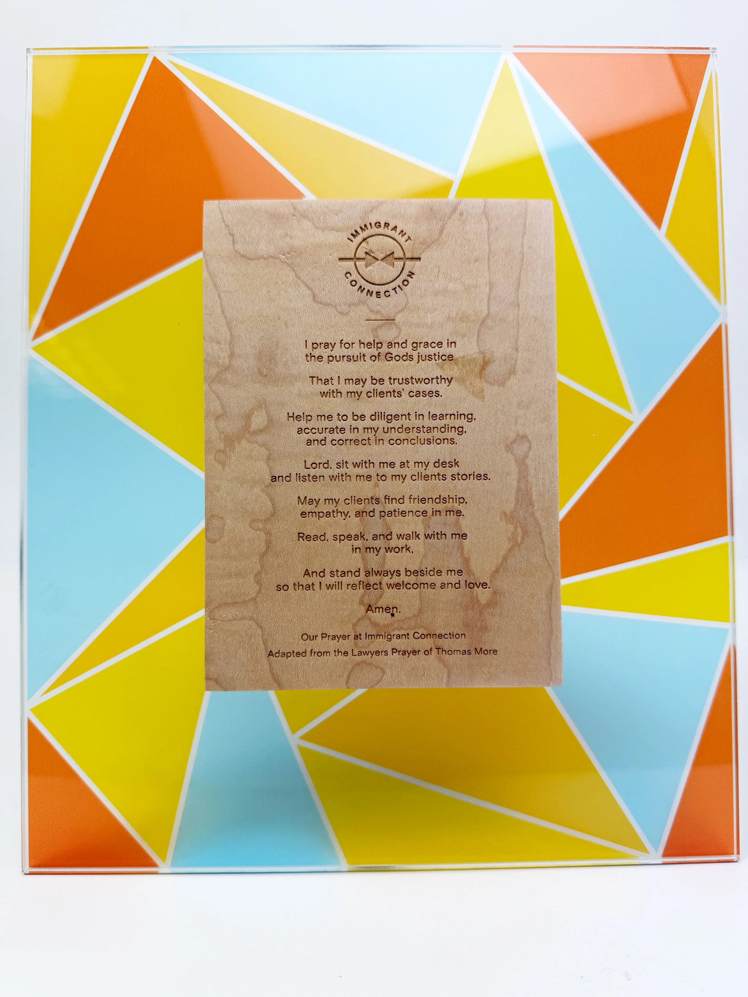 Printed acrylic stained glass award with laser-engraved maple wood 'Immigrant Connection' prayer card. Custom printing and custom fabrication in Portland, Oregon by MC Laser Labs.