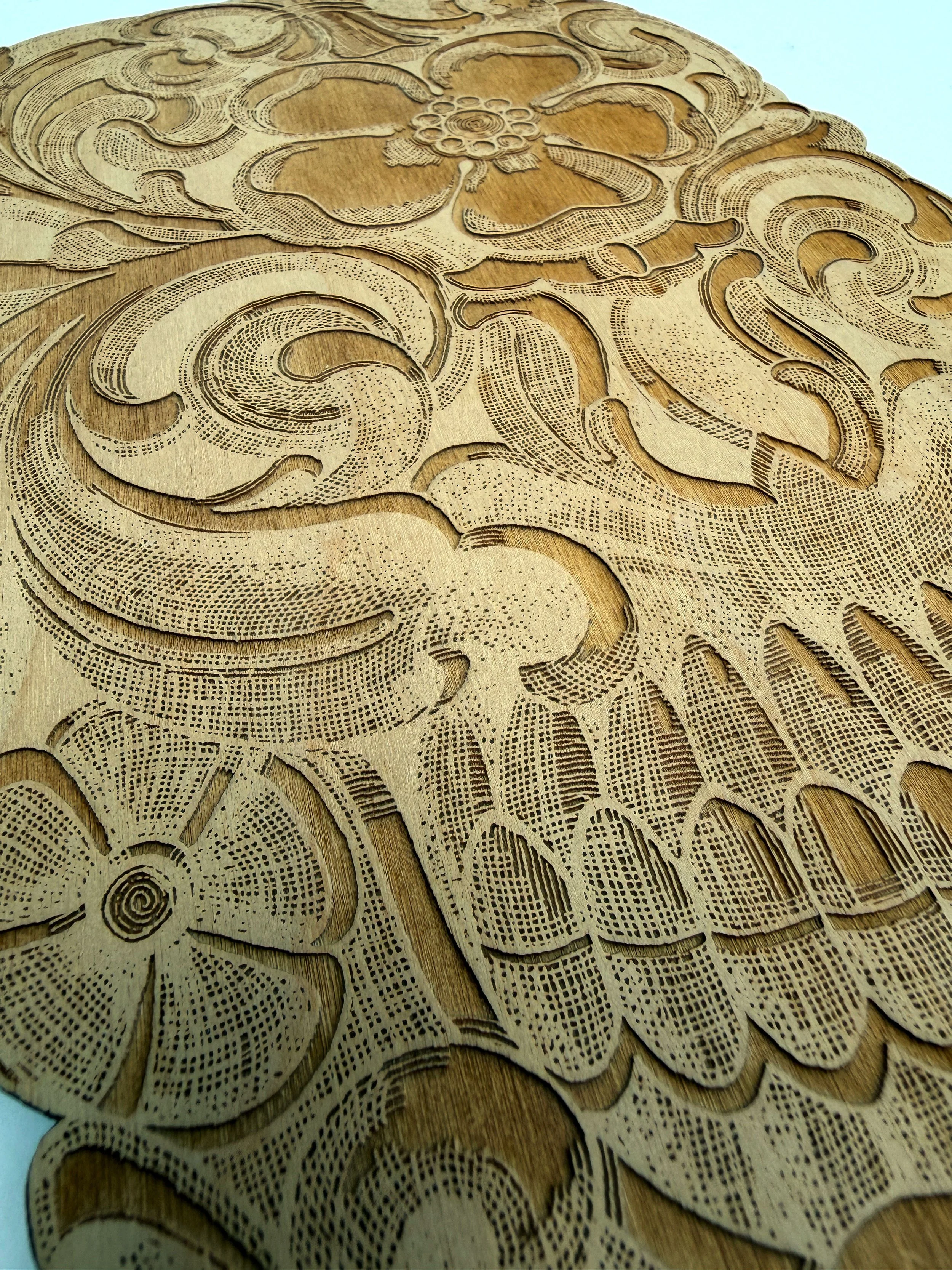CO2 laser engraved wooden panel with intricately carved floral and swirl patterns, custom laser engraving by MC Laser Labs.