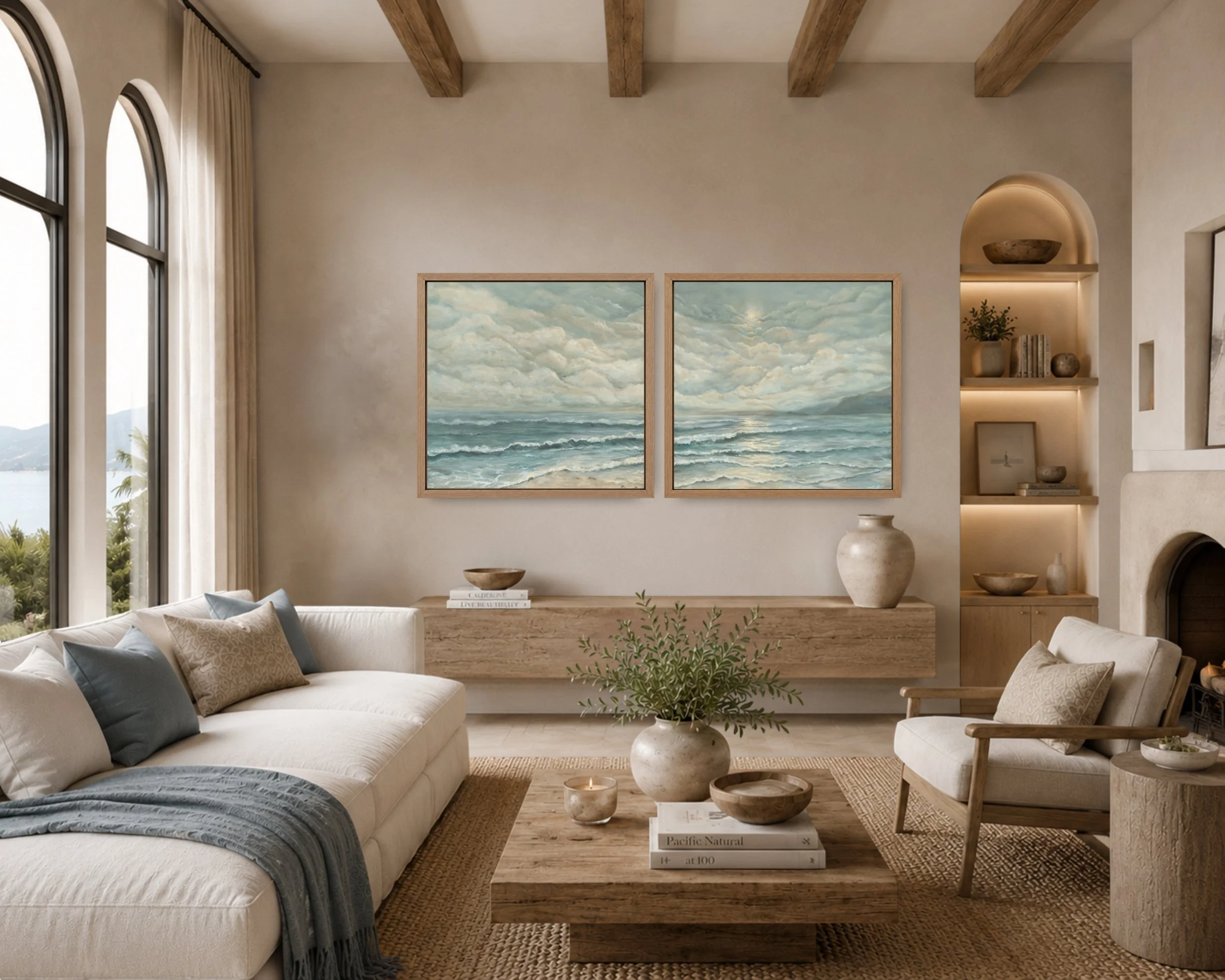 Pair of framed ocean paintings displayed in a warm neutral living room.