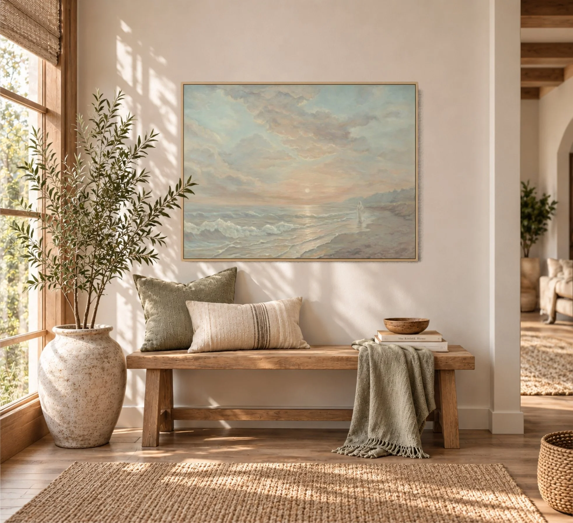 Framed seascape painting displayed above a wooden bench in a warm, sunlit entryway.wooden floor.