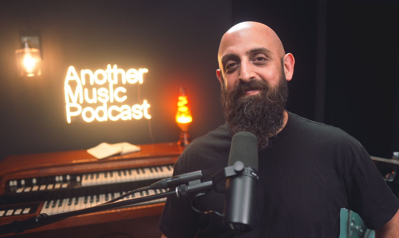 Me in front of mic in podcast studio.png