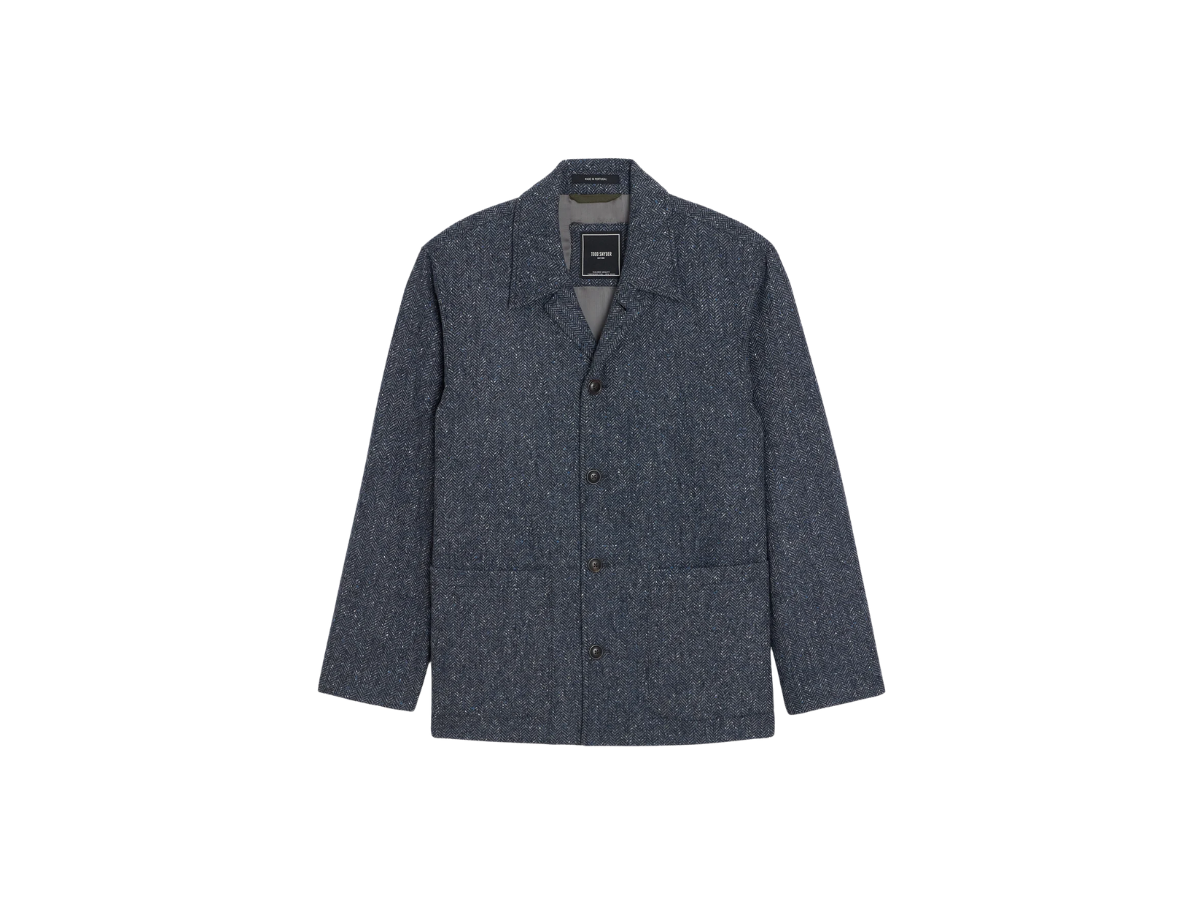 A dark gray, long-sleeve, button-up men's chore coat with a subtle textured pattern, isolated on a white background.