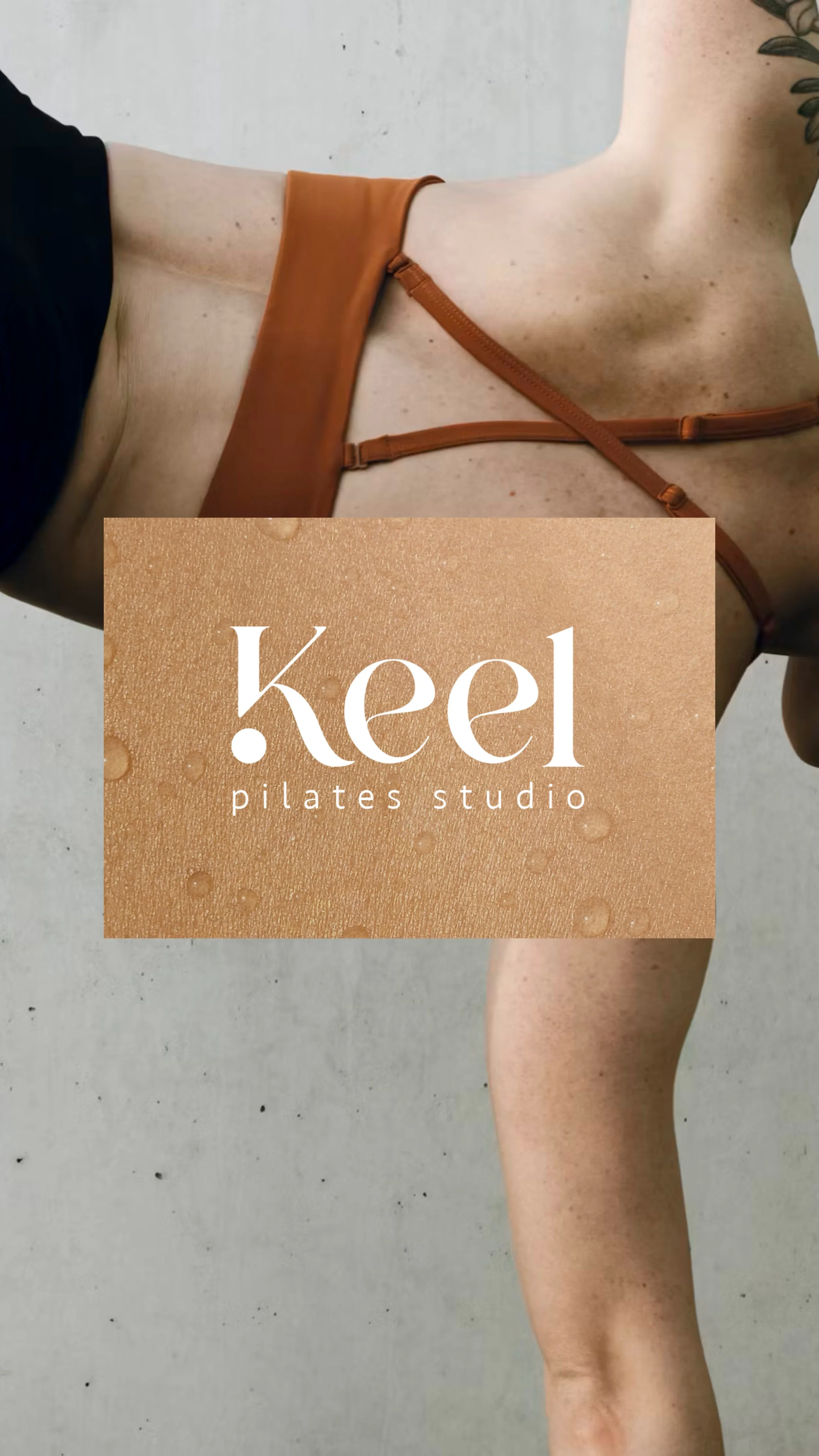 Image of a person's leg and arm on a concrete floor, with a tan-colored logo overlay that reads 'Keel Pilates Studio' on a textured background with water droplets.