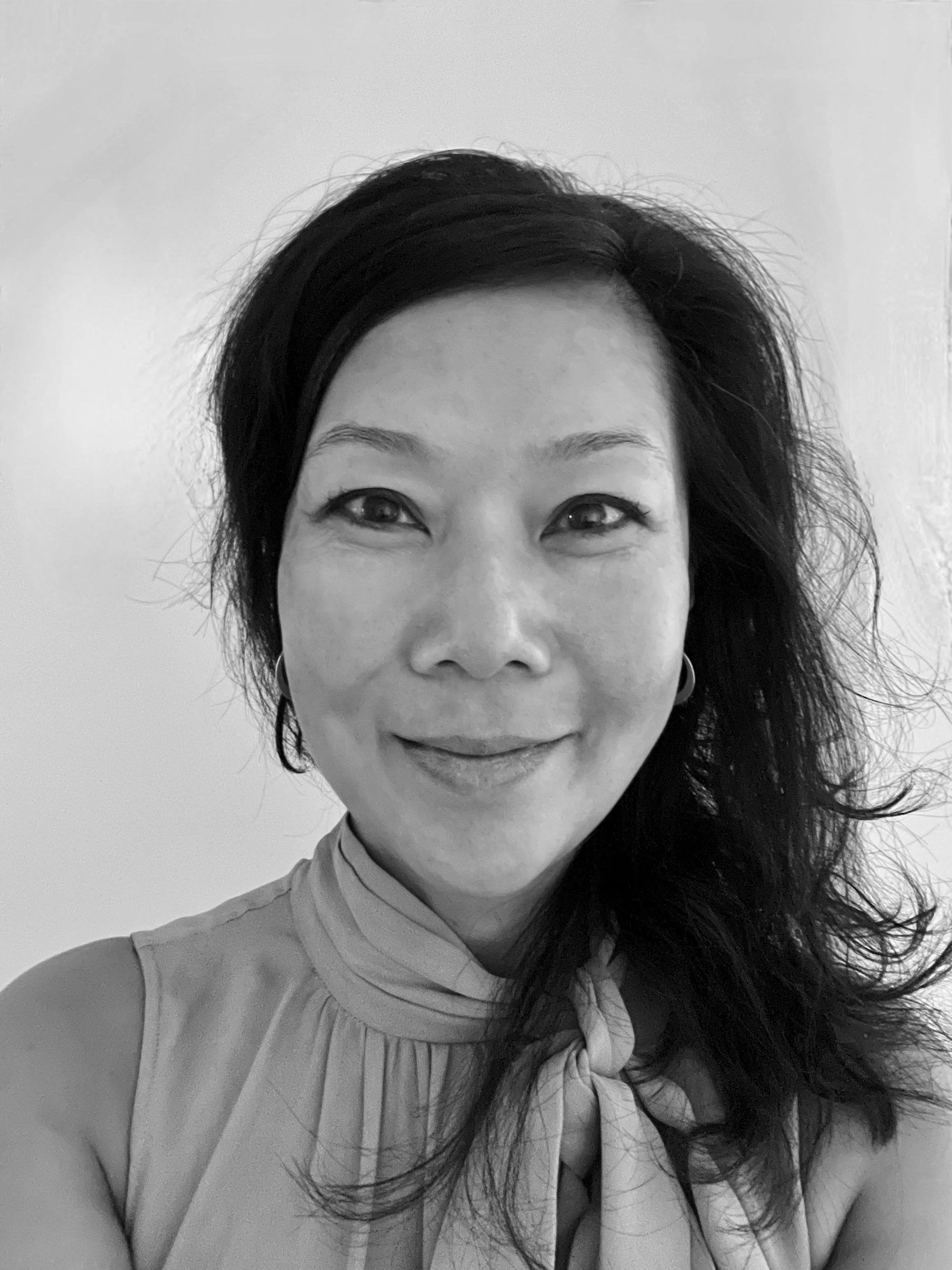 Black and white photo of Angie Woo, Founder & Principal of Think Resilience Inc.