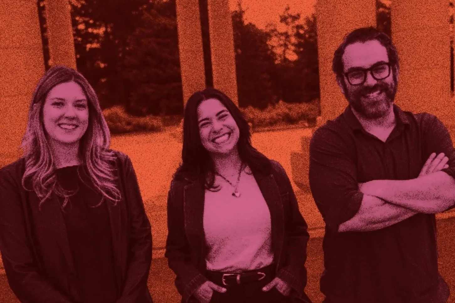 Three smiling people standing indoors in front of a the Cheesman Park pavillion
