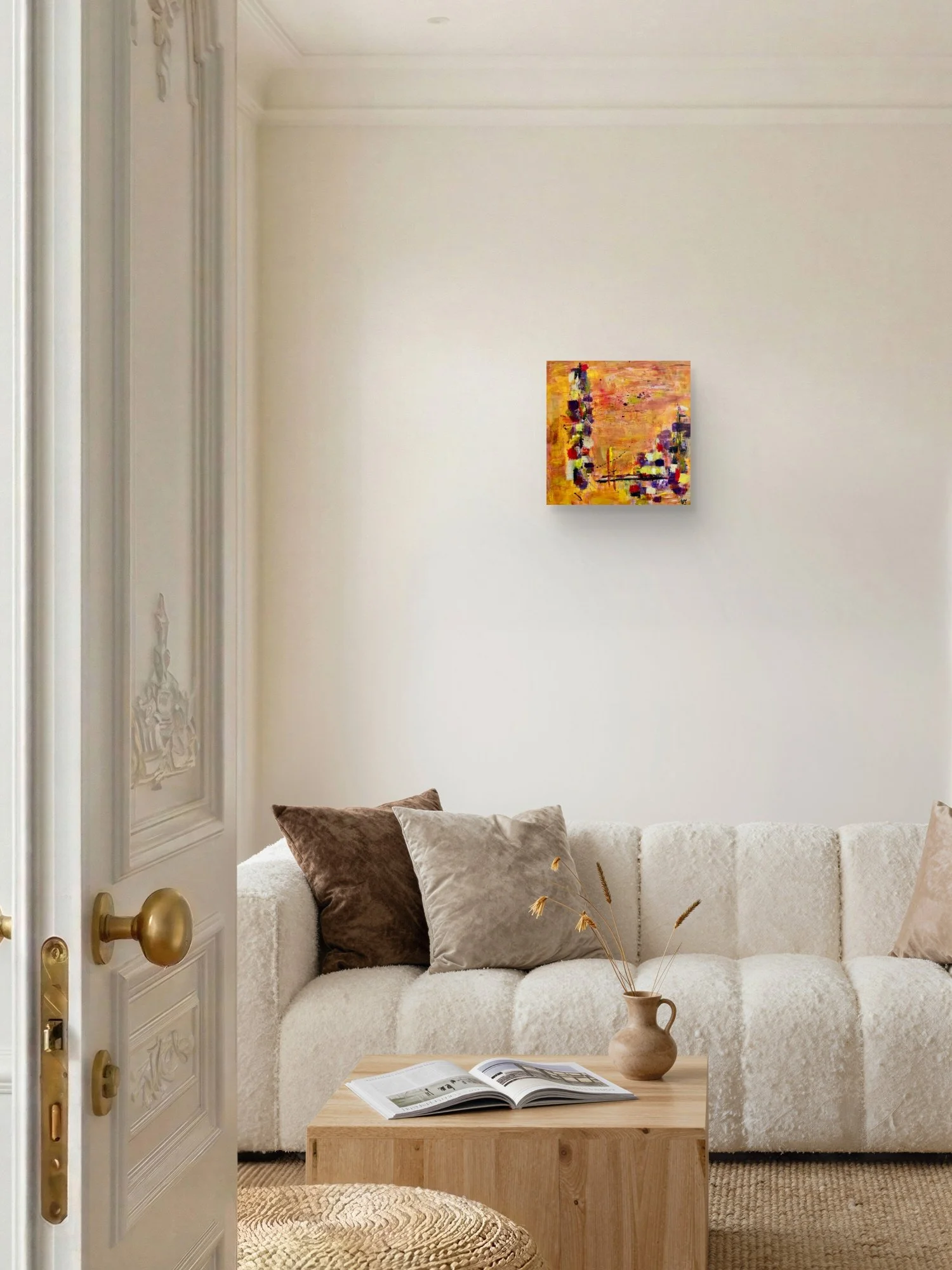 Incandescent Metamorphosis abstract fine art print by Virginie Bergar — 16 x 16 in displayed above a cream sofa in a warm contemporary living room