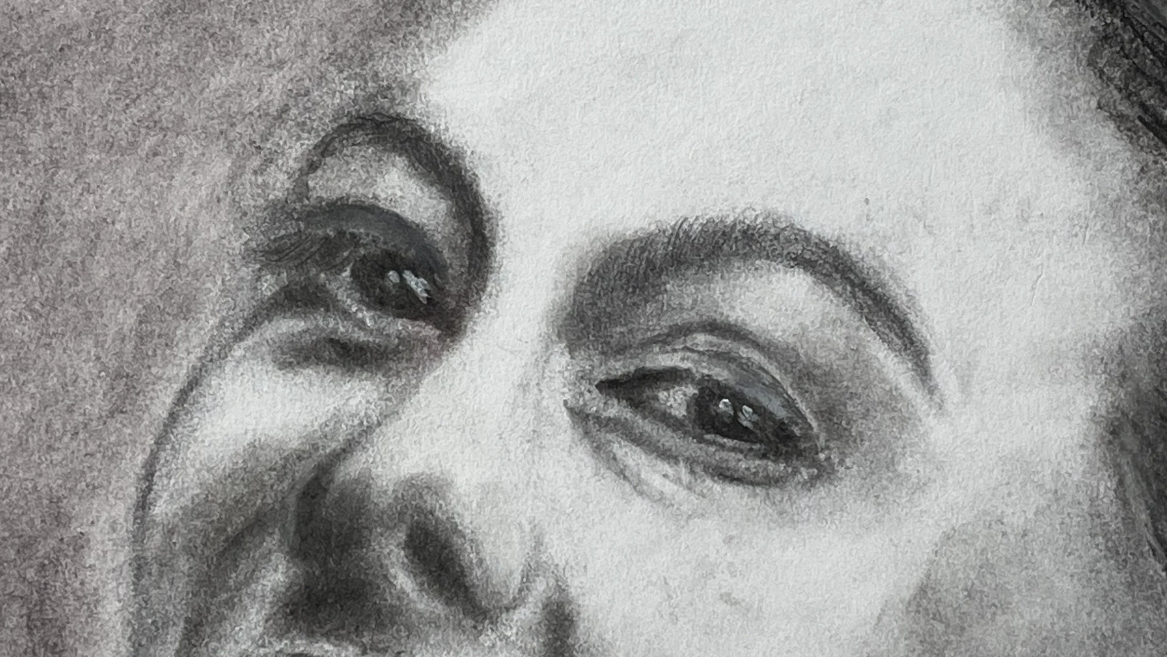 Detail of the eyes and upper face in She Laughs Anyway, revealing delicate tonal work and expressive drawing.