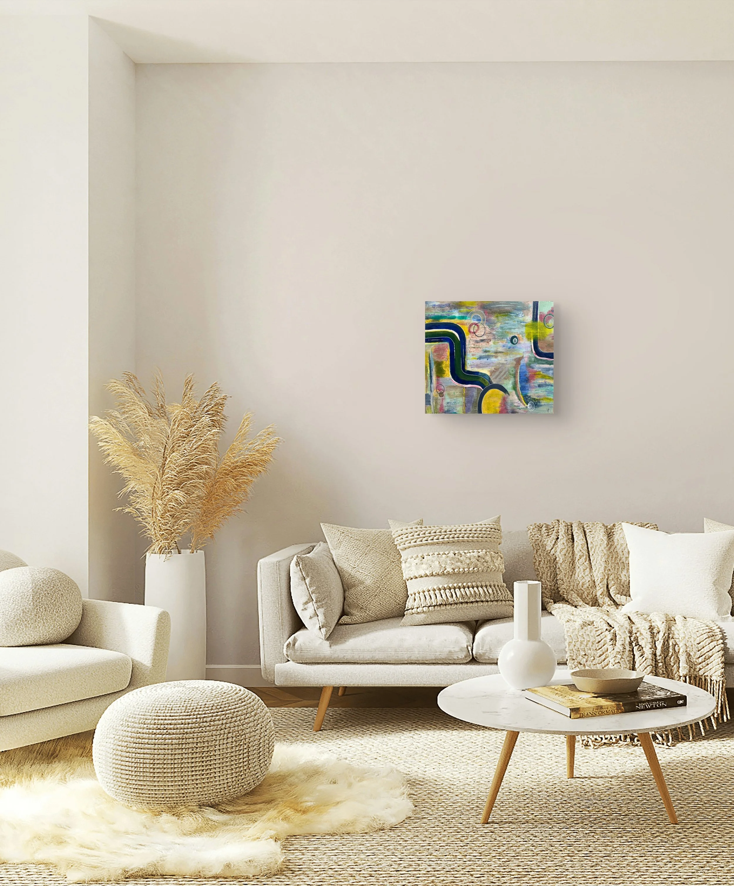 The Soul in Colour displayed above a neutral sofa in a soft cosy living room, showing how the abstract painting brings colour to a calm interior.