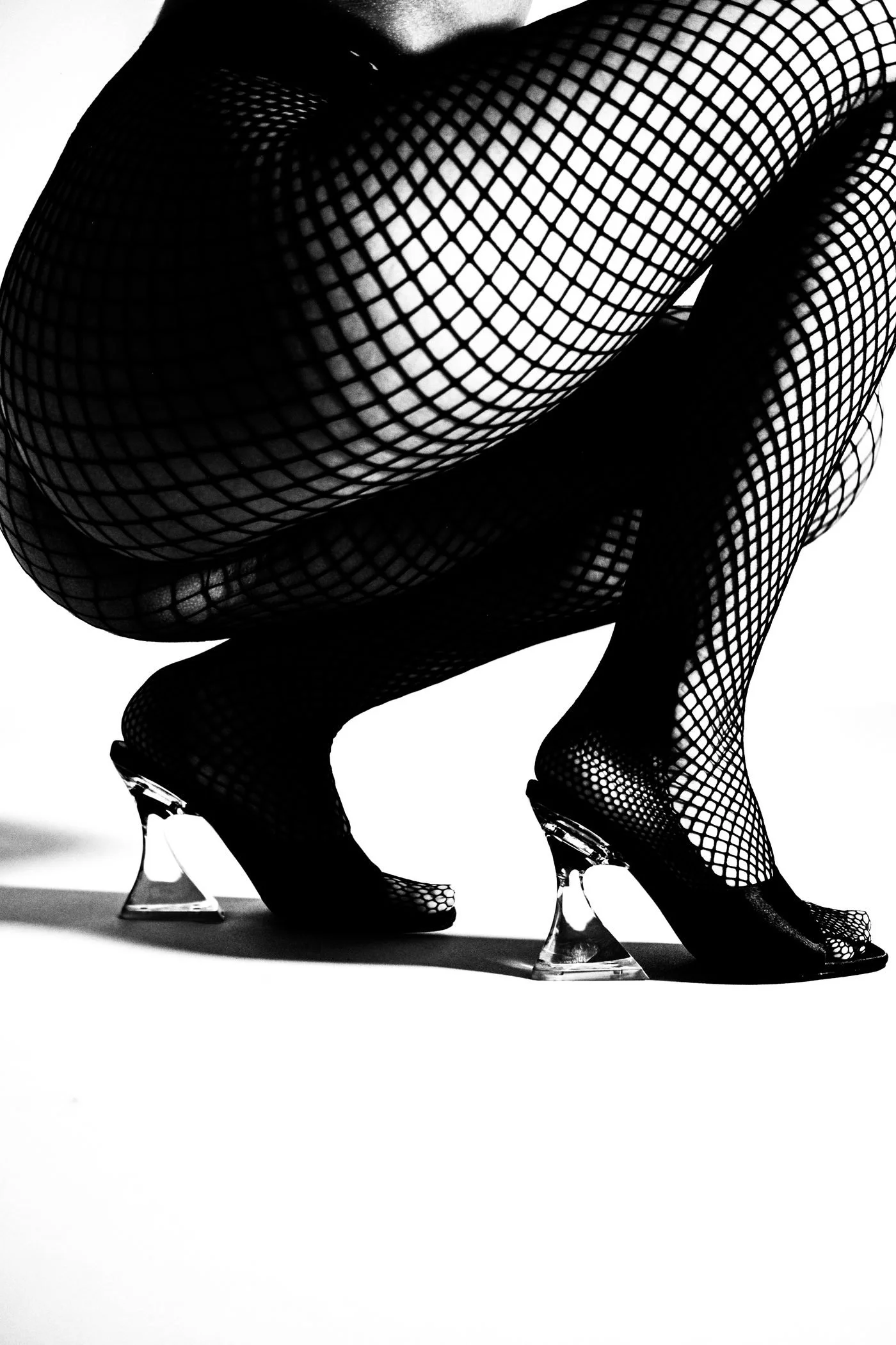 Black and white fishnet and shoe detail from the Unfiltered fashion photography series by CAMR Visuals