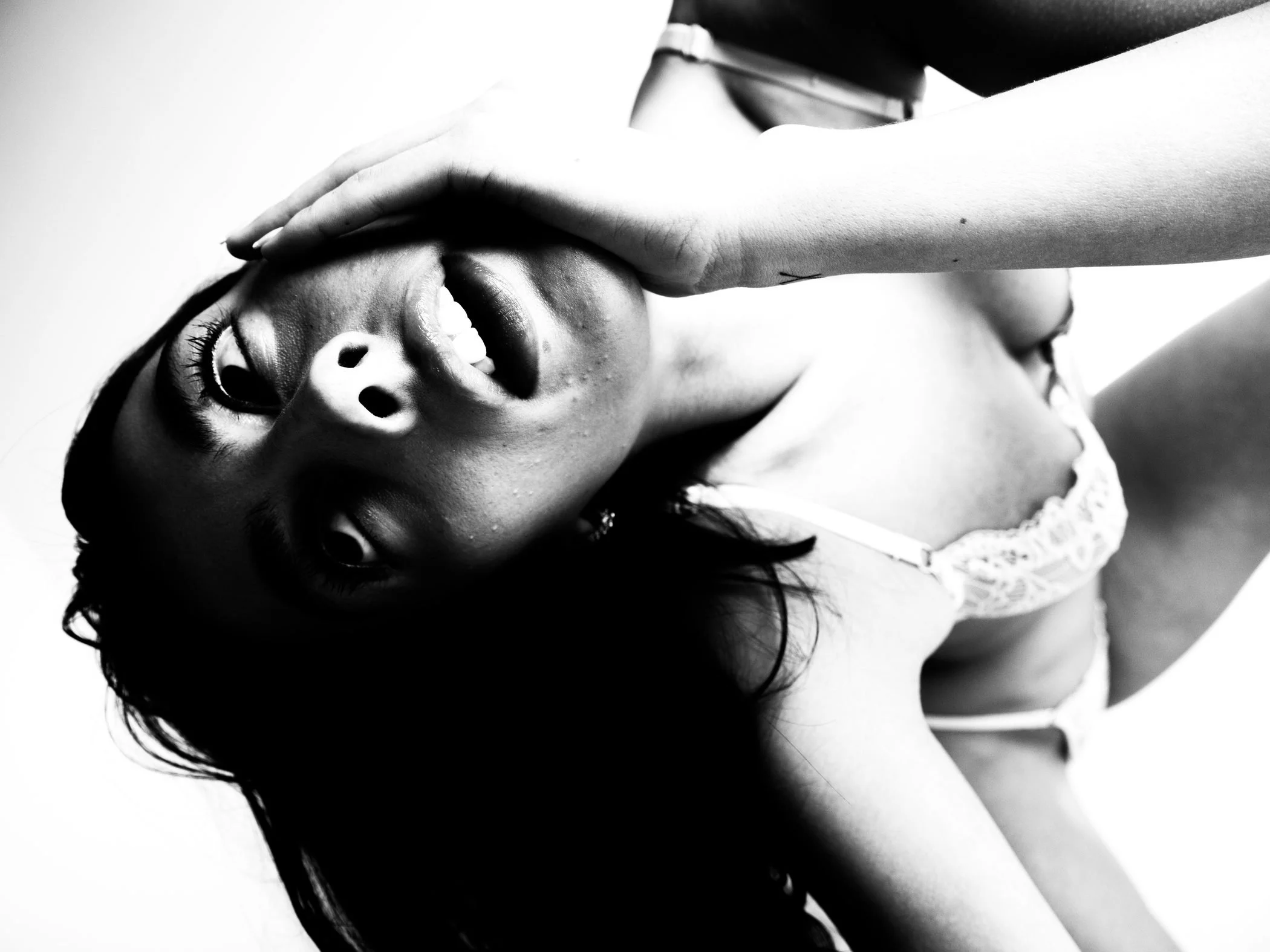 Black and white diagonal close up portrait from the Unfiltered fashion photography series by CAMR Visuals