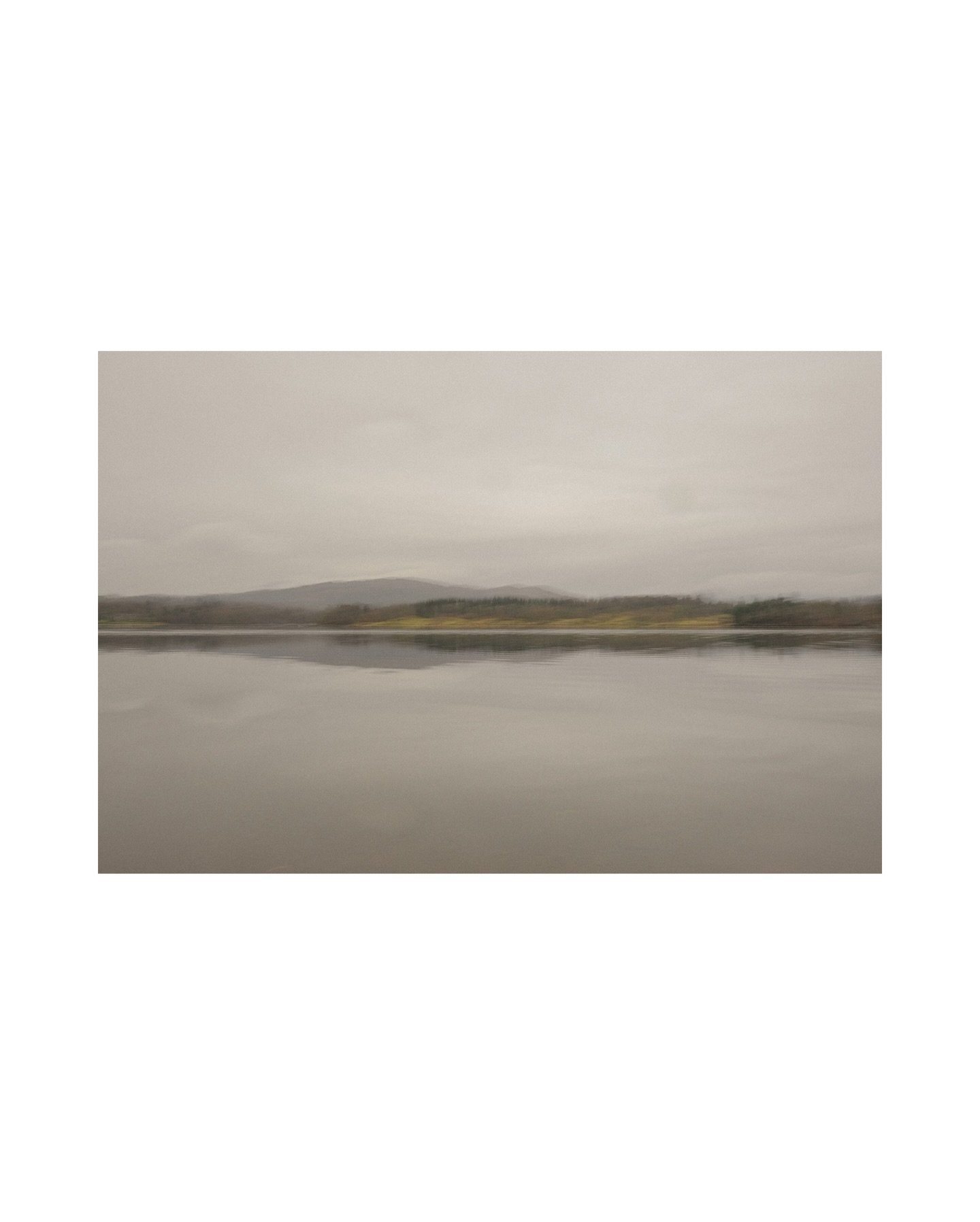 Soft painterly study of Lake Windermere beneath a muted sky.