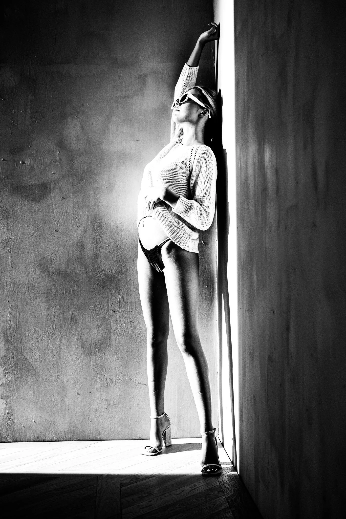 Black and white atmospheric spotlight portrait from the Unfiltered fashion photography series by CAMR Visuals