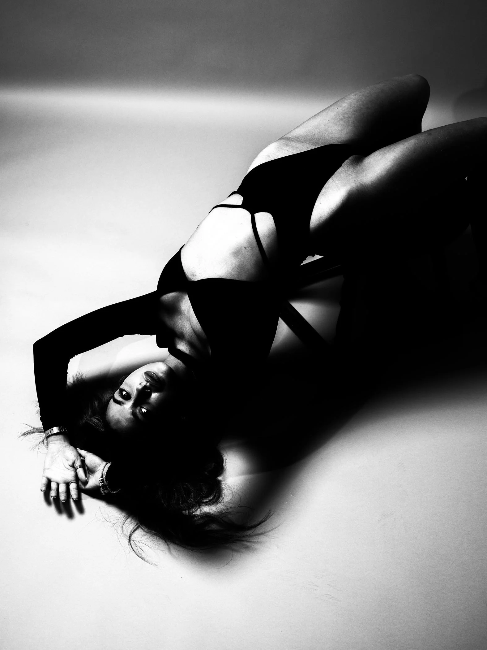 Black and white reclining fashion crop from the Unfiltered fashion photography series by CAMR Visuals