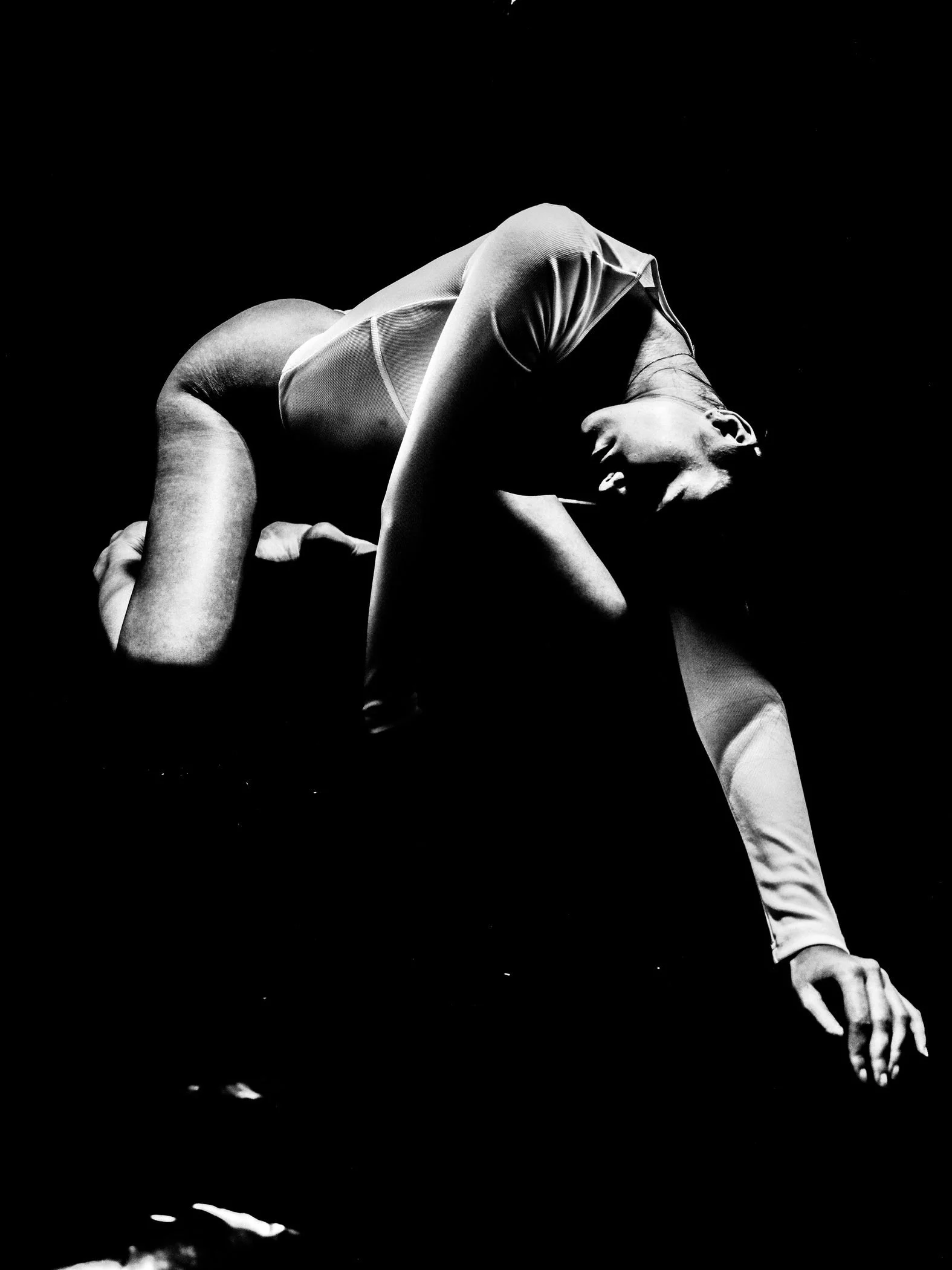Black and white dramatic backbend pose from the Unfiltered fashion photography series by CAMR Visuals