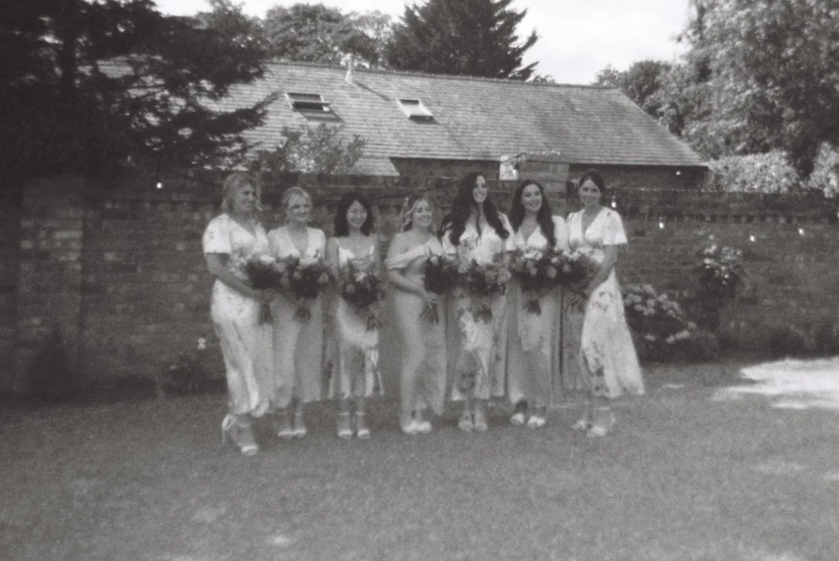 Bridesmaids photographed naturally during a wedding celebration