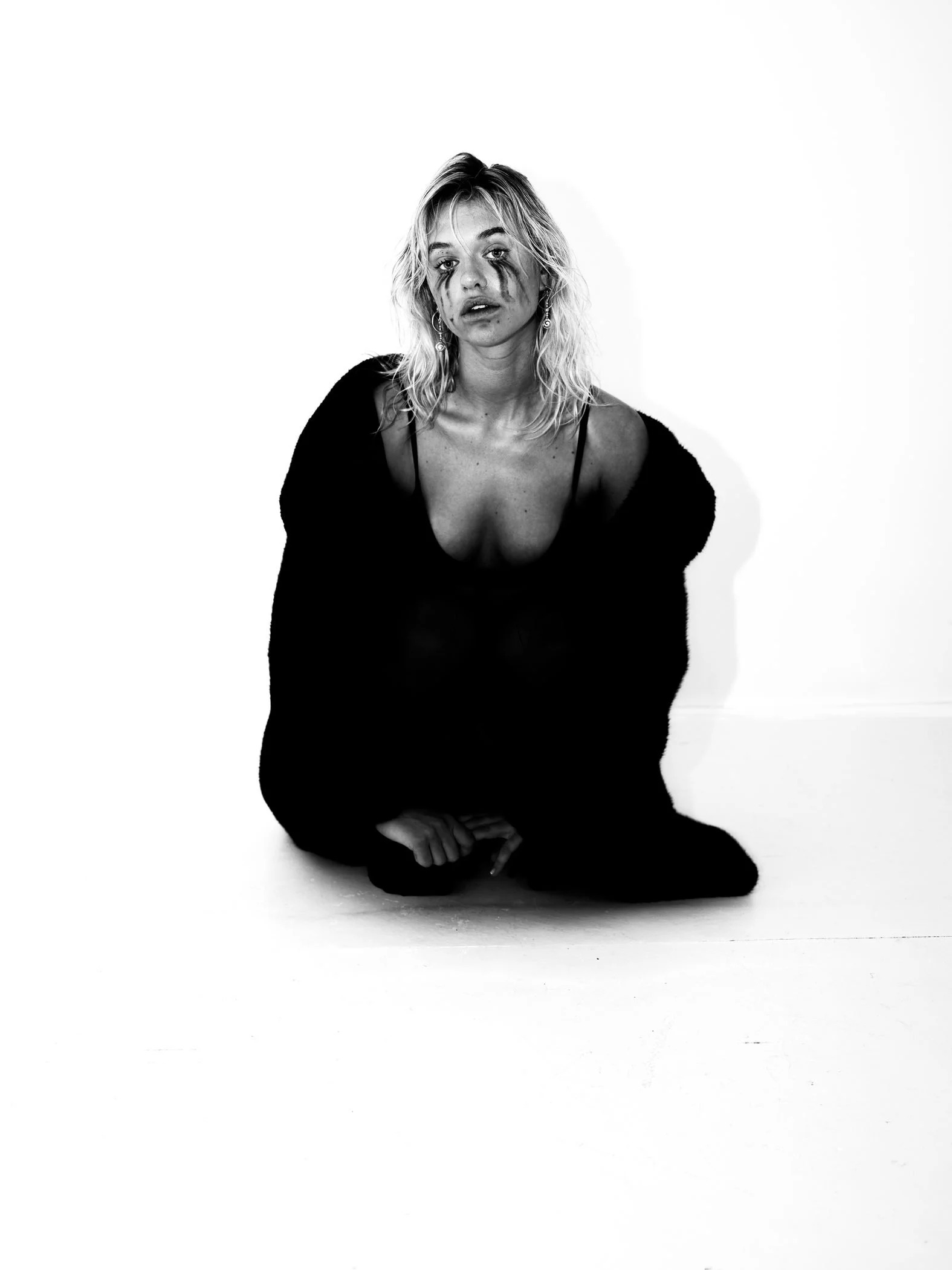 Black and white seated black styling portrait from the Unfiltered fashion photography series by CAMR Visuals