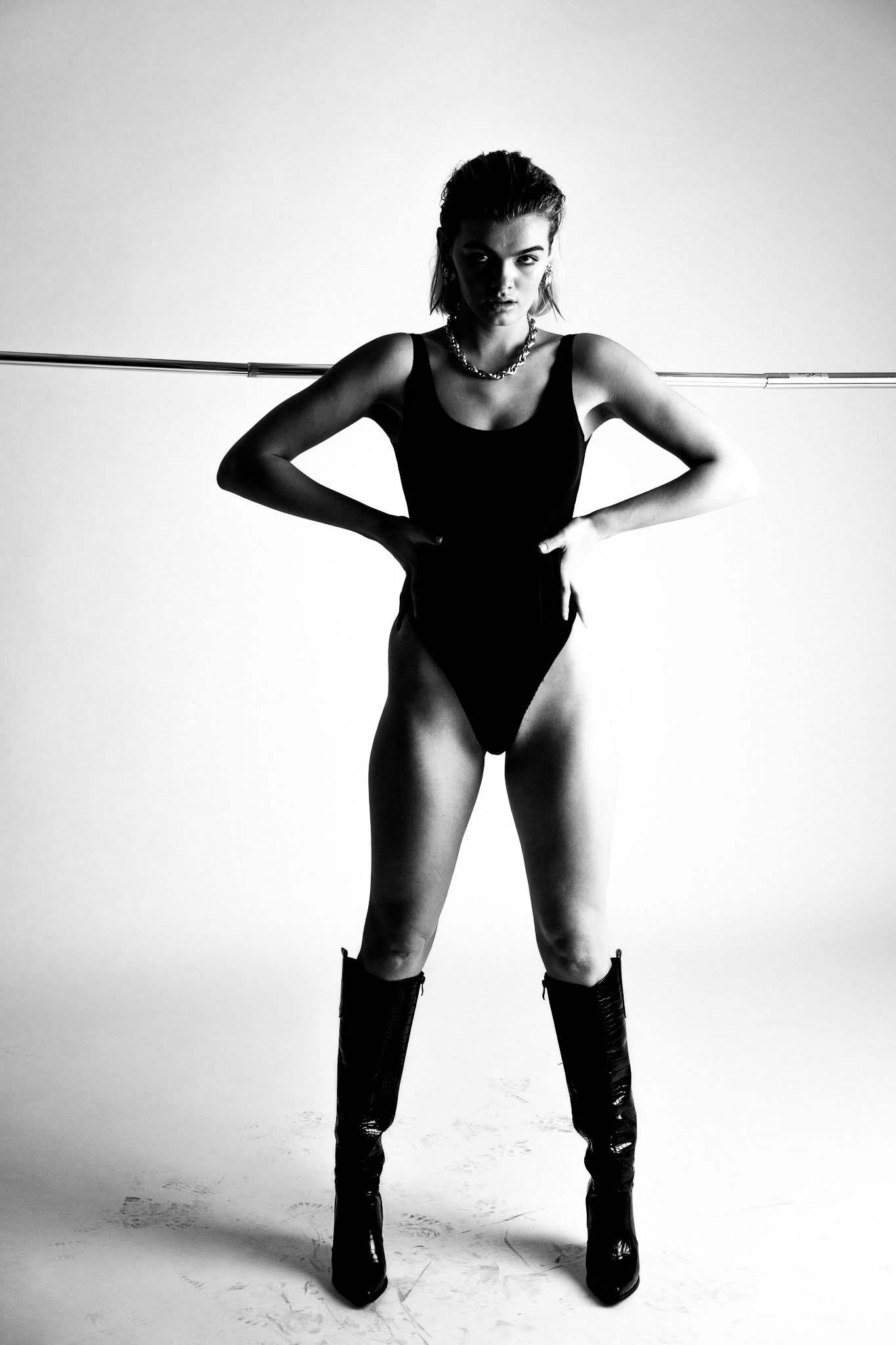 Black and white bodysuit and boots fashion portrait from the Unfiltered fashion photography series by CAMR Visuals