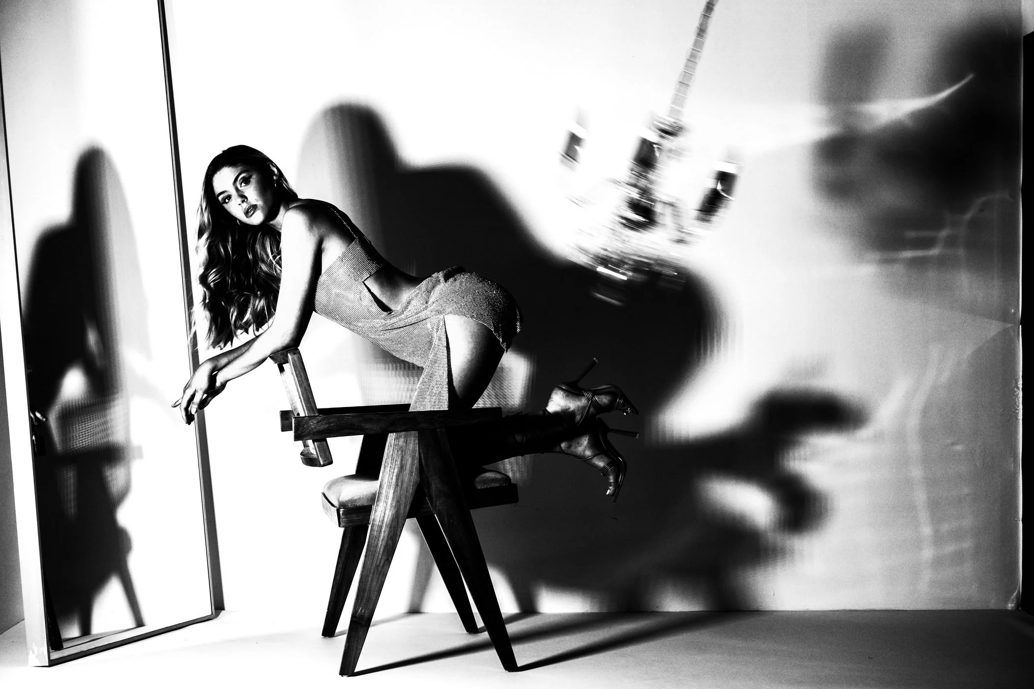 Black and white chair shadow studio portrait from the Unfiltered fashion photography series by CAMR Visuals