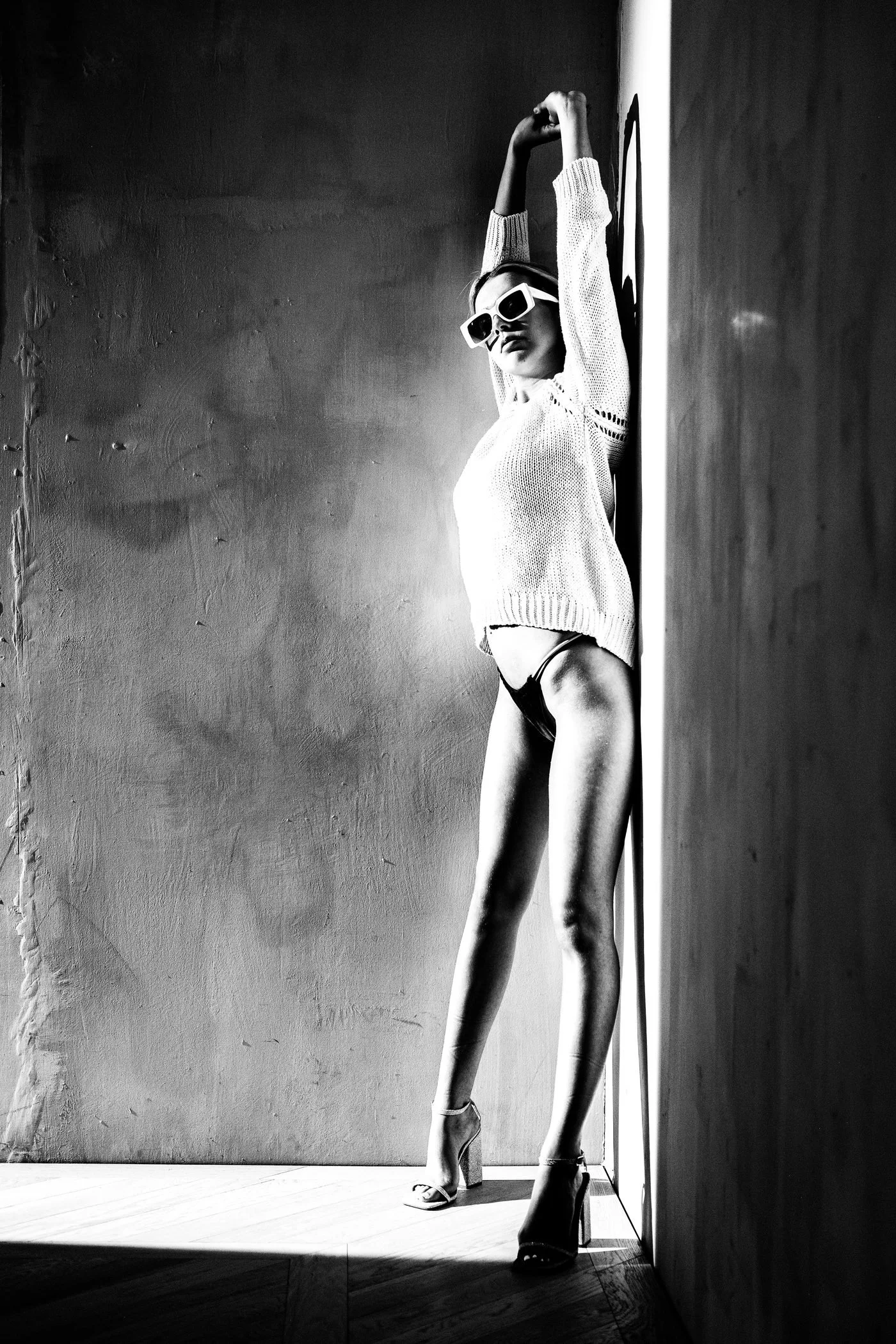 Black and white standing shadow portrait from the Unfiltered fashion photography series by CAMR Visuals