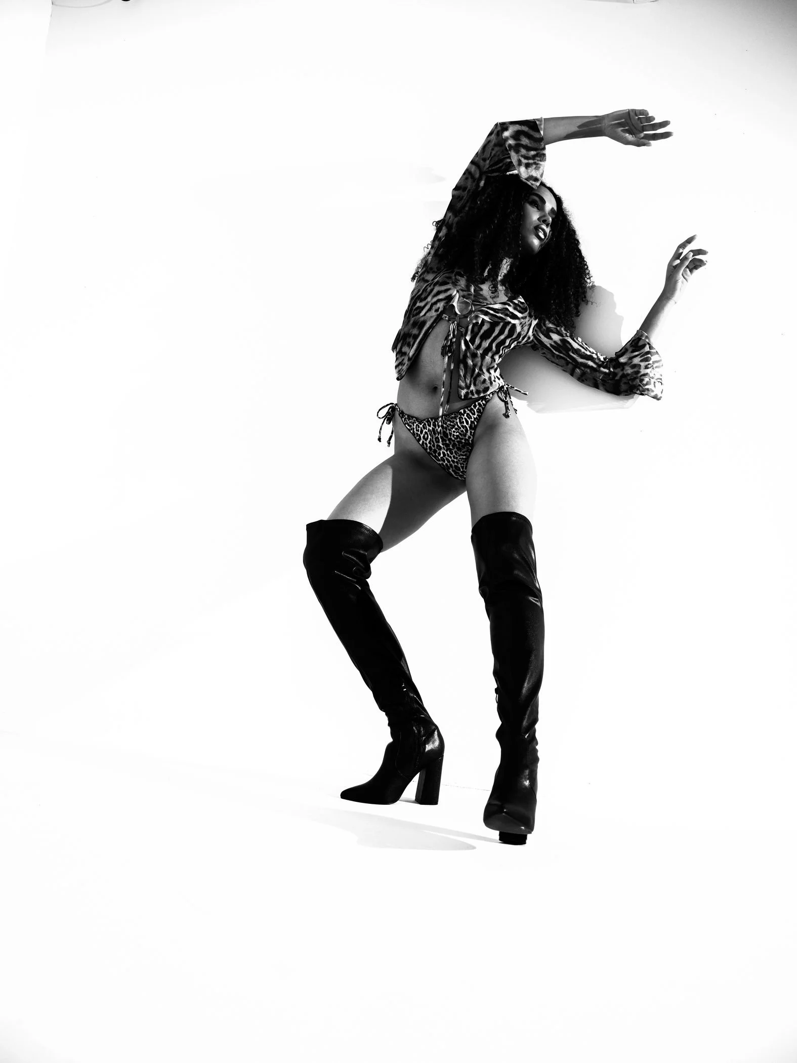 Black and white polka dot crouching pose from the Unfiltered fashion photography series by CAMR Visuals