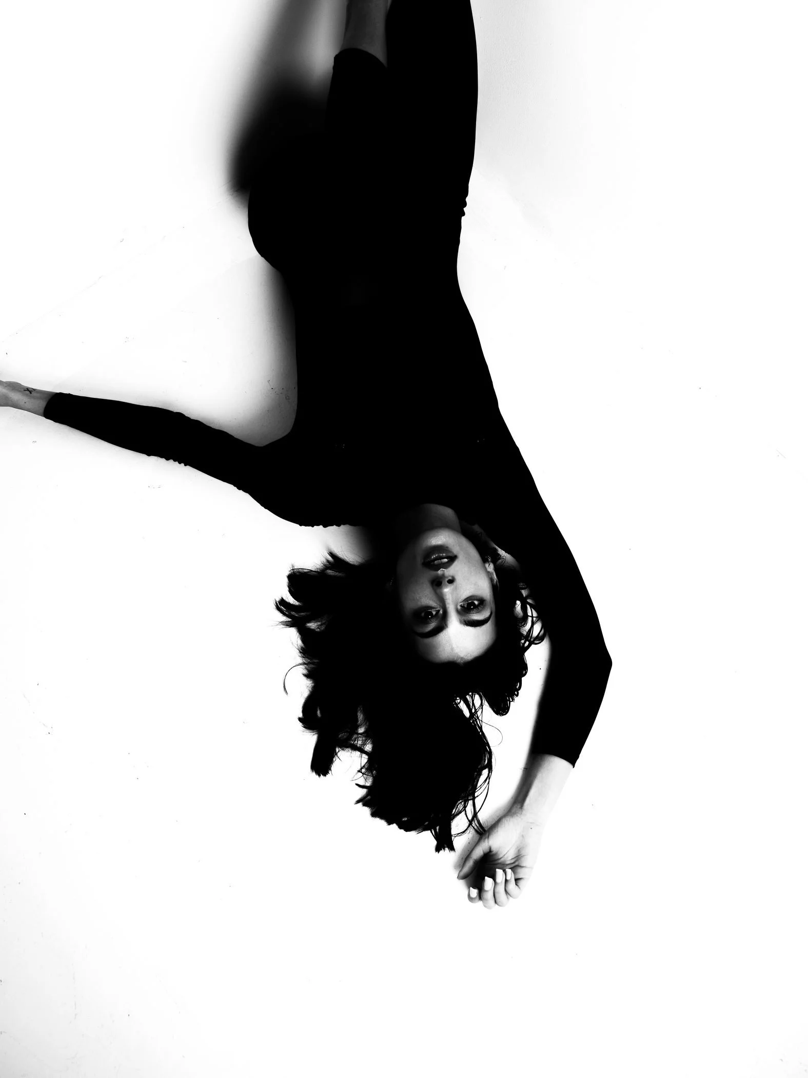 Black and white inverted coat movement from the Unfiltered fashion photography series by CAMR Visuals