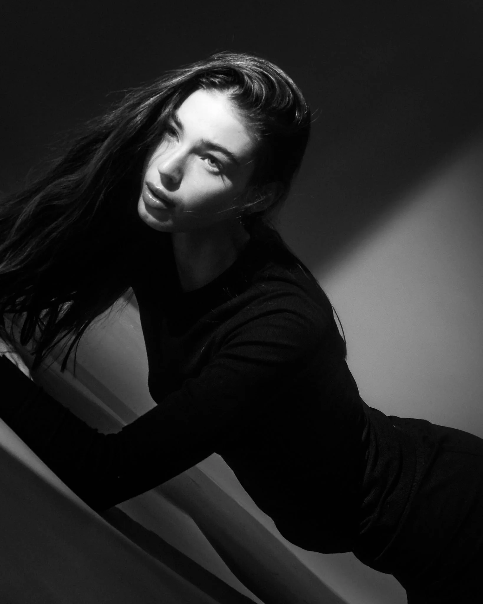 Black and white low light documentary portrait from the Unfiltered fashion photography series by CAMR Visuals