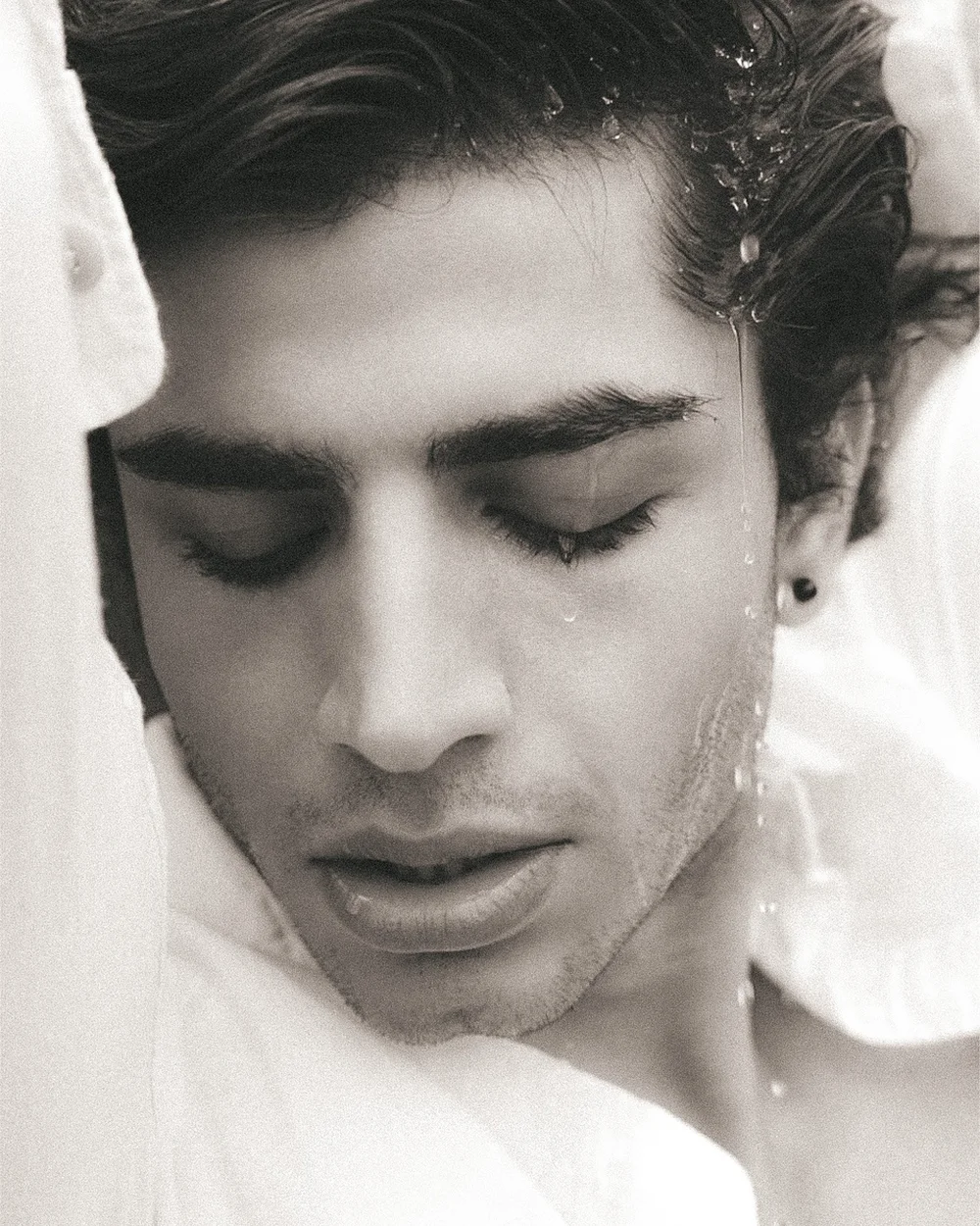 Wet white shirt, close editorial portrait. Photography by CAMR Visuals.