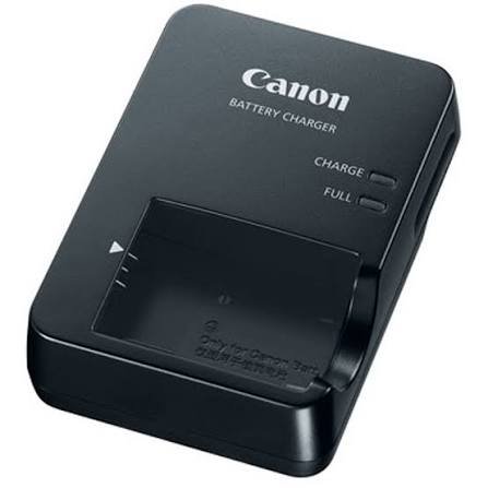 Canon battery charger with indicator lights and a battery slot